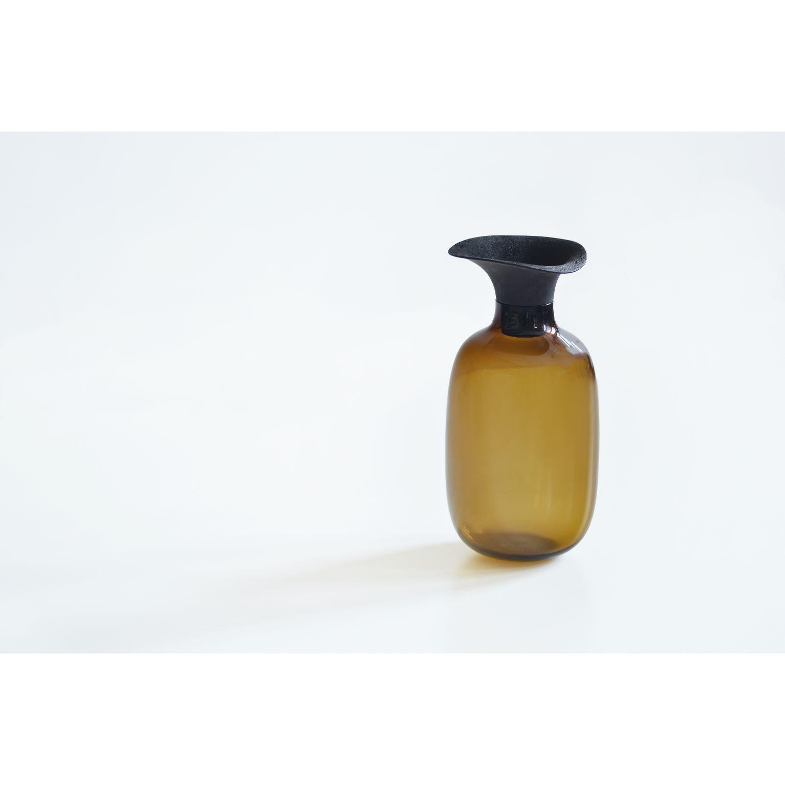 Large Vieno bottle by Antrei Hartikainen
Materials: Glass, linden wood, black stain & natural oil wax
Dimensions: 
Width 20cm
Depth 20cm
Height 28cm
Bottle diameter 20 cm

Limited Edition

  

Vieno combine delicate and shiny glass as
