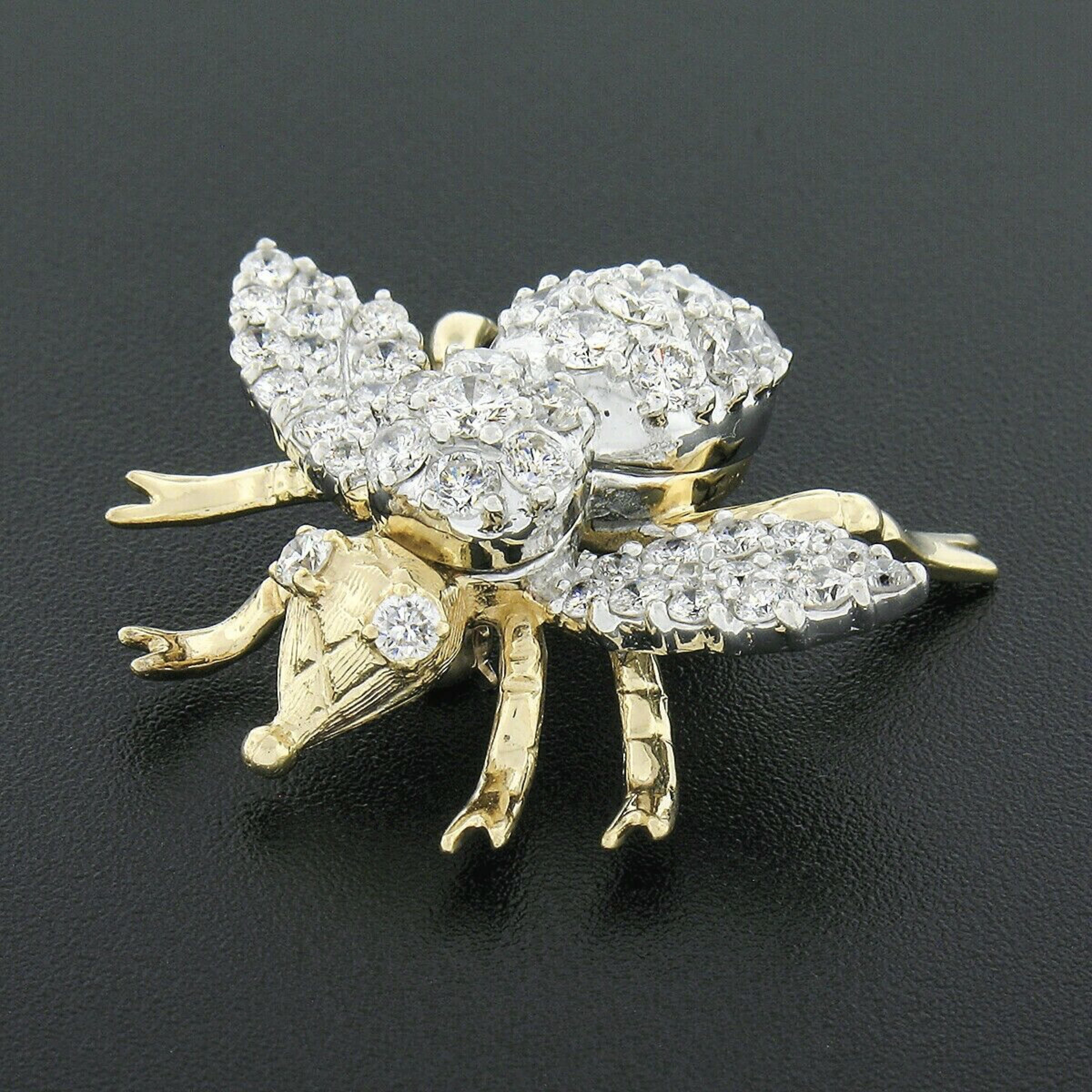 Here we have an absolutely magnificent vintage brooch that was crafted from solid 14 yellow and white gold. It features a large and nicely detailed fly/bee insect design that is drenched with fine diamonds totaling approximately 3 carats in weight.