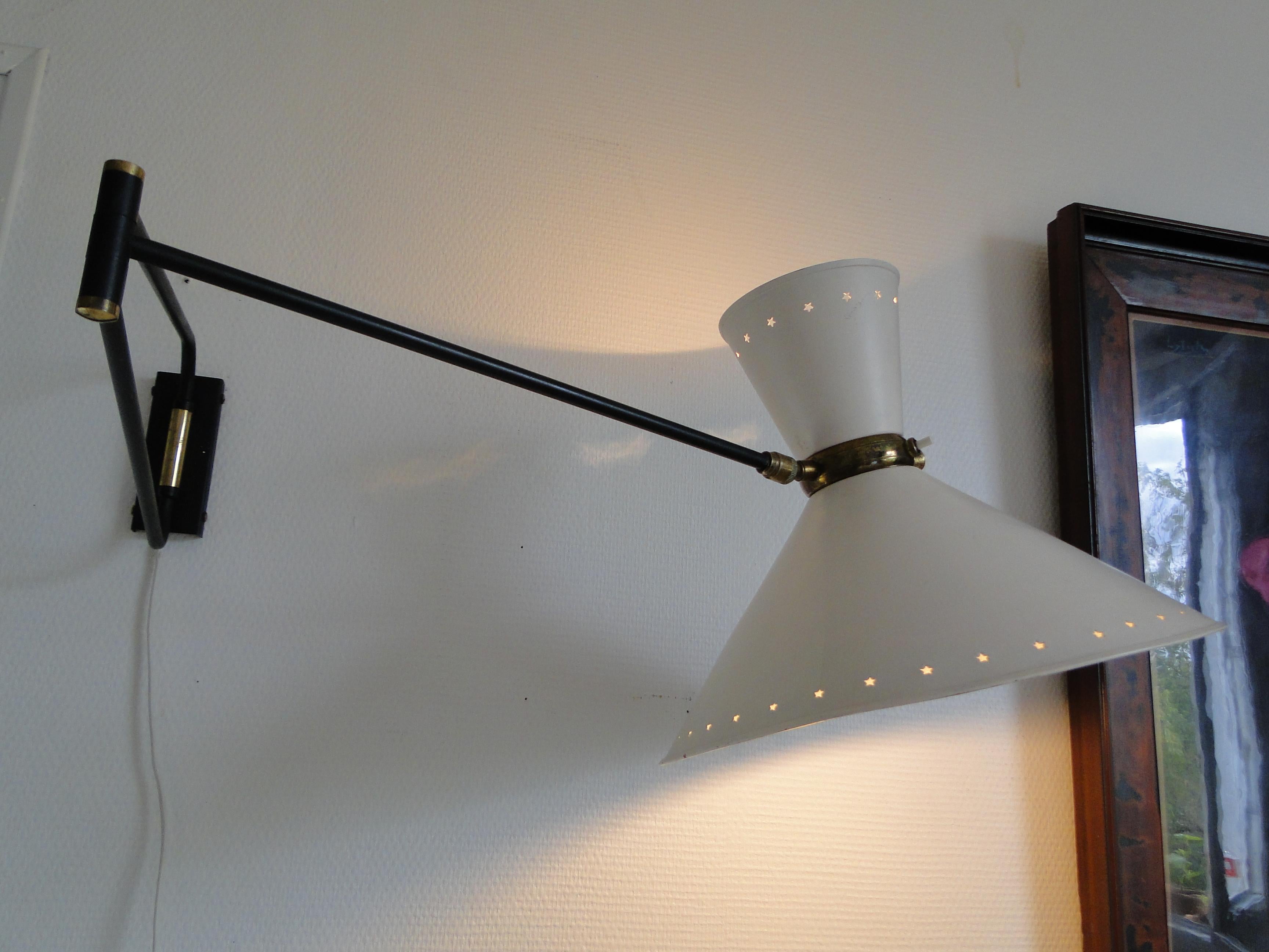 Vintage large wall lamp by René Mathieu 1950 France.

Wall light by René Mathieu from the 1950s.

2-Arm articulated metal and brass stem.

The double bulb sconce has independent switches for the up and down lights. 

A painting on the lampshade is