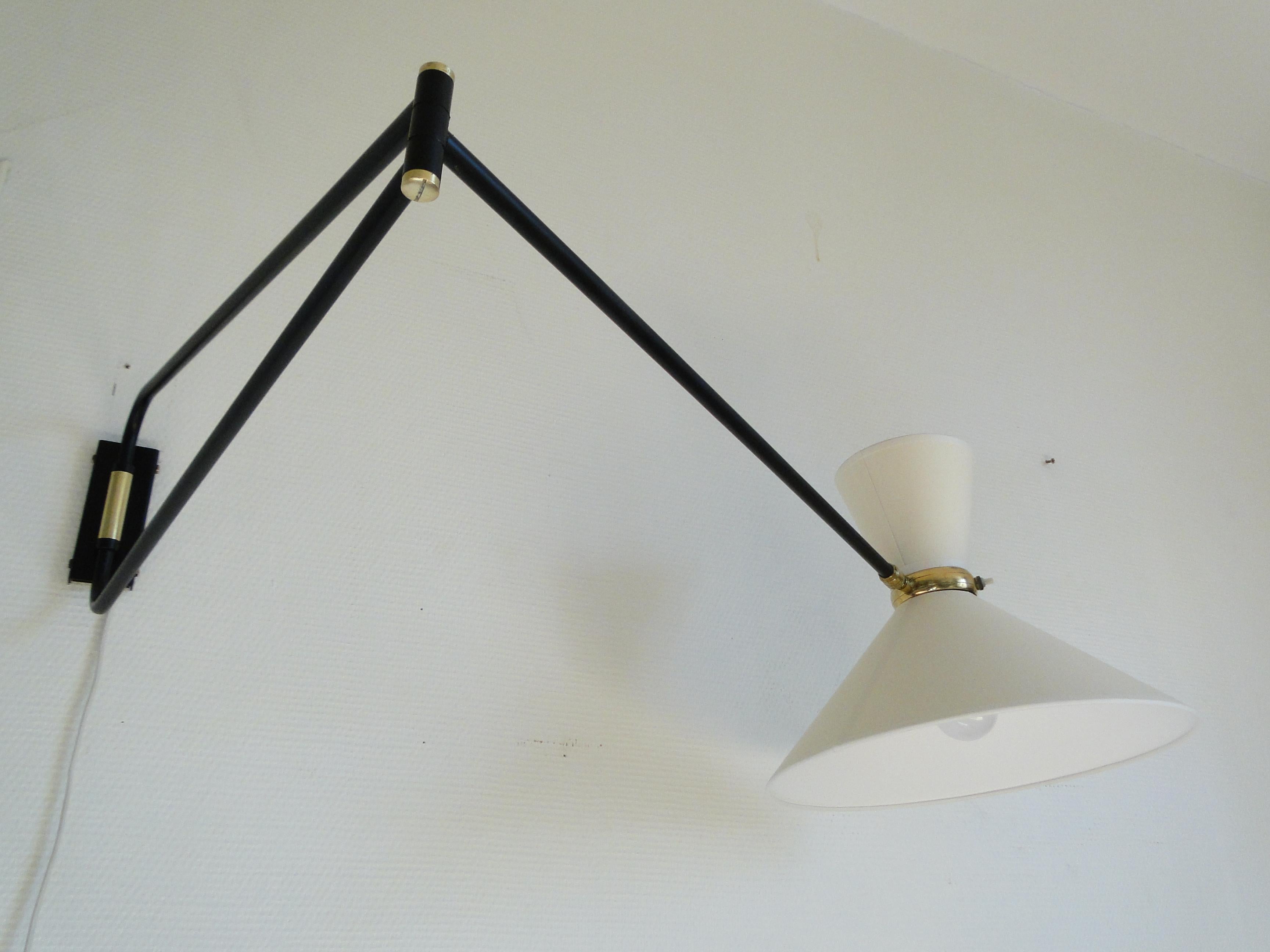 Vintage very large wall lamp by René Mathieu 1950 France.

Wall light by René Mathieu from the 1950s.

2-Arm articulated metal and brass stem.

The double bulb sconce has independent switches for the up and down lights. 

New diabolo