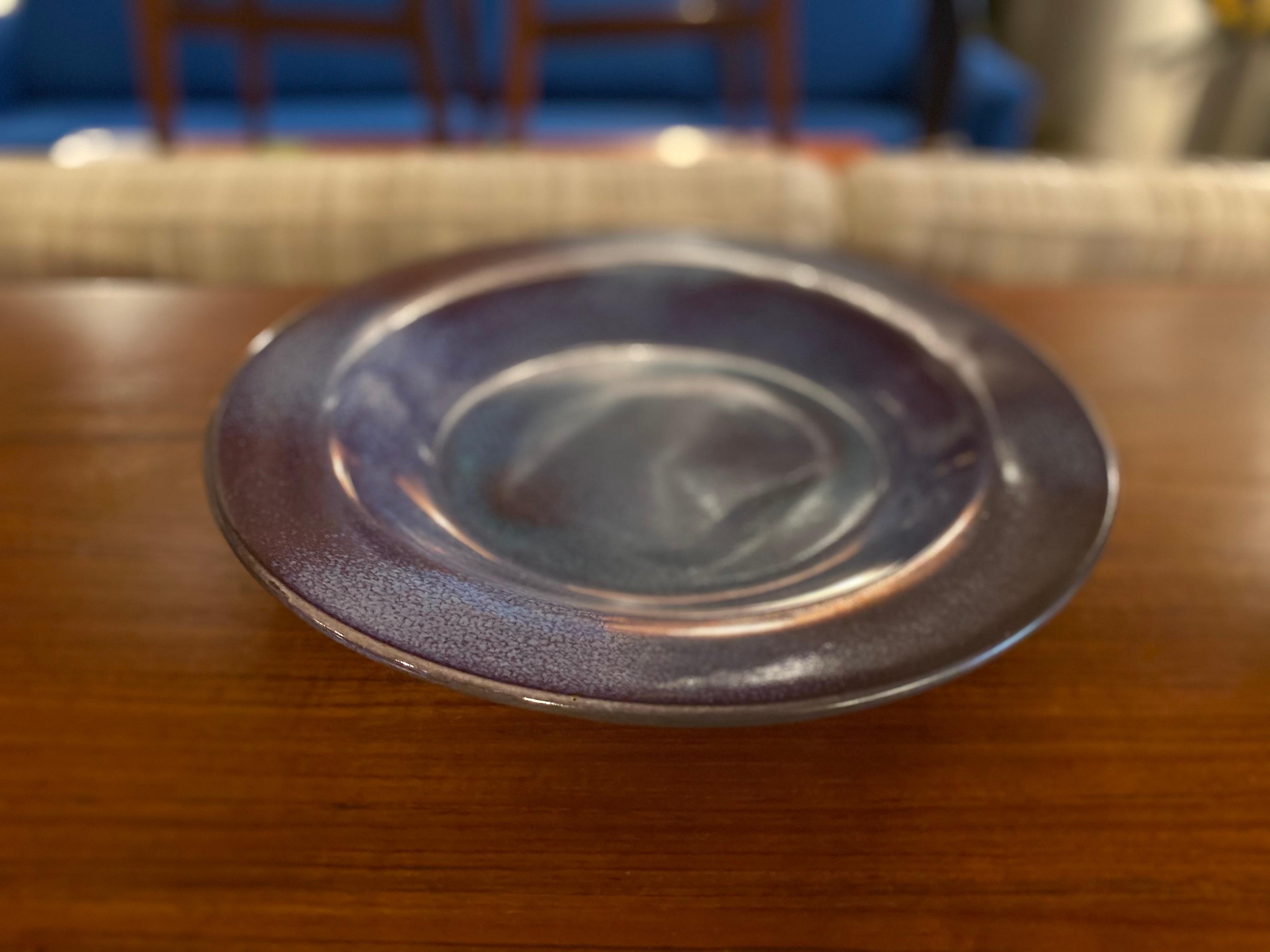 Stunning vintage ceramic bowl made in 1957 by Texas Ceramist Harding Black. Very large decorative bowl features a beautiful glaze with purple and blue hues. This ceramic glazed bowl is in great condition.