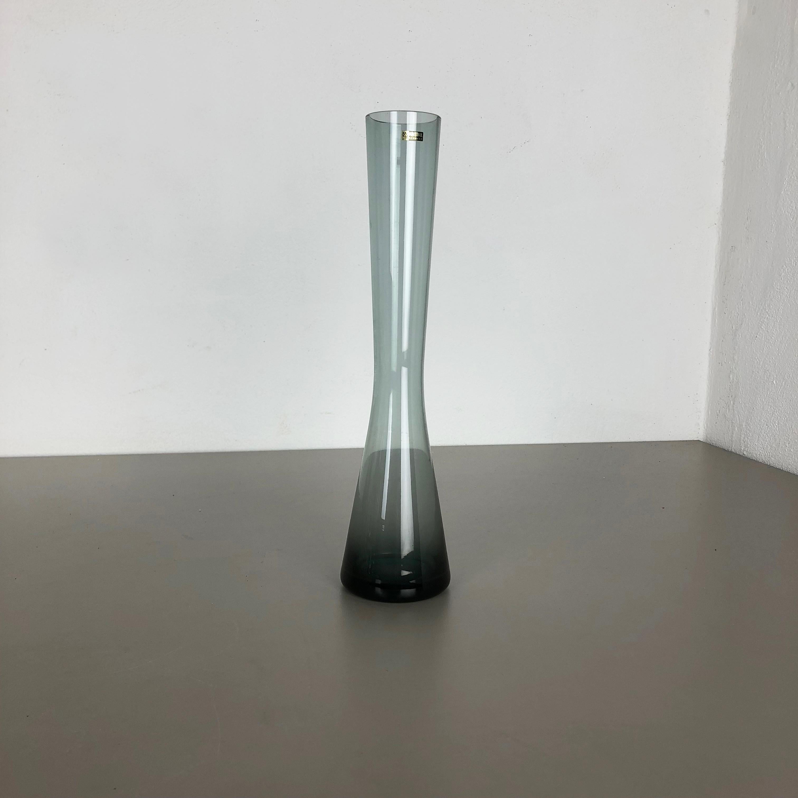 Article:

Glass vase


Producer:

WMF Württembergische Metallwaren Fabrik in Geislingen 


Designer:

Wilhelm Wagenfeld 


Design:

WMF turmalin series


Decade:

1960s



Original vintage 1960s vase of the Wagenfeld
