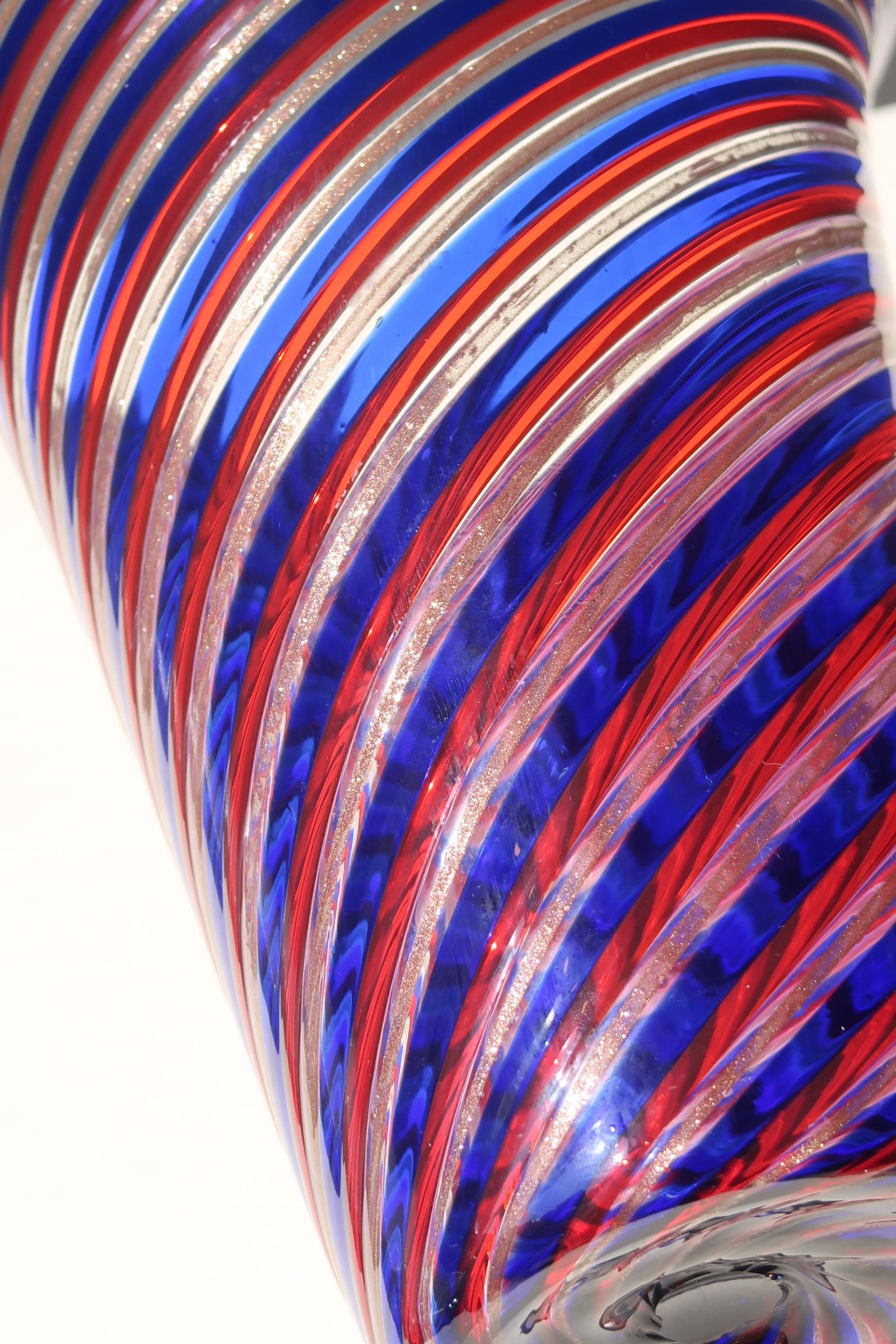 Unusual large vintage Murano A Canne Filigrana vase with lid in deep shades of red, blue and copper. Mouth-blown glass in a technique known primarily from the glass houses Venini, Gio Ponti and Fratelli Toso. Handmade in Italy, 1970s.
H:26.5cm