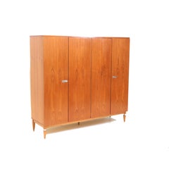 Large vintage 4-door wardrobe made of teak from the 1960s