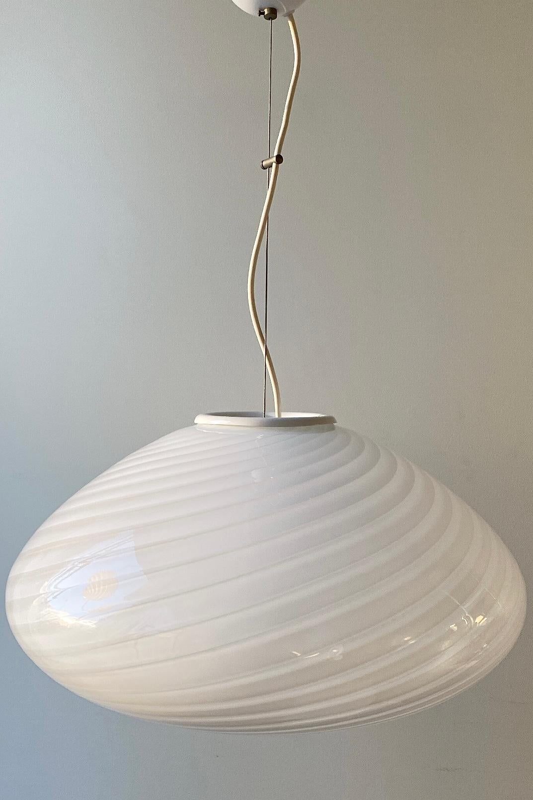 Extra-large vintage Murano pendant ceiling lamp in opaline glass. The glass is mouth-blown in an oval shape with a beautiful swirl pattern. Handcrafted in Italy, 1970s, and comes with adjustable suspension. D: 50cm H: 26cm (glass).