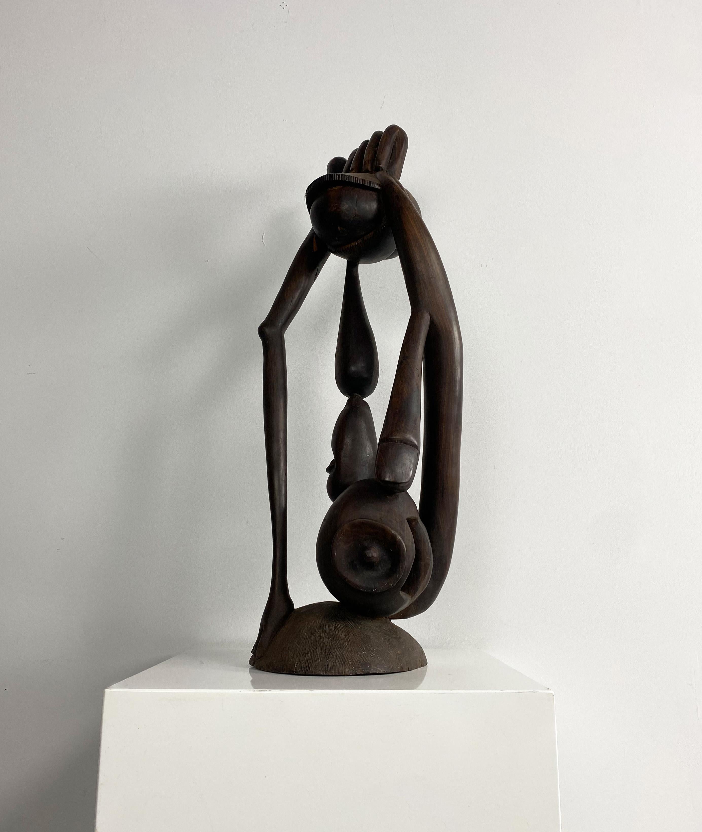 Vintage abstract African sculpture. 

Dimensions (cm, approx): 
Height: 76
Width: 27
Depth: 27.