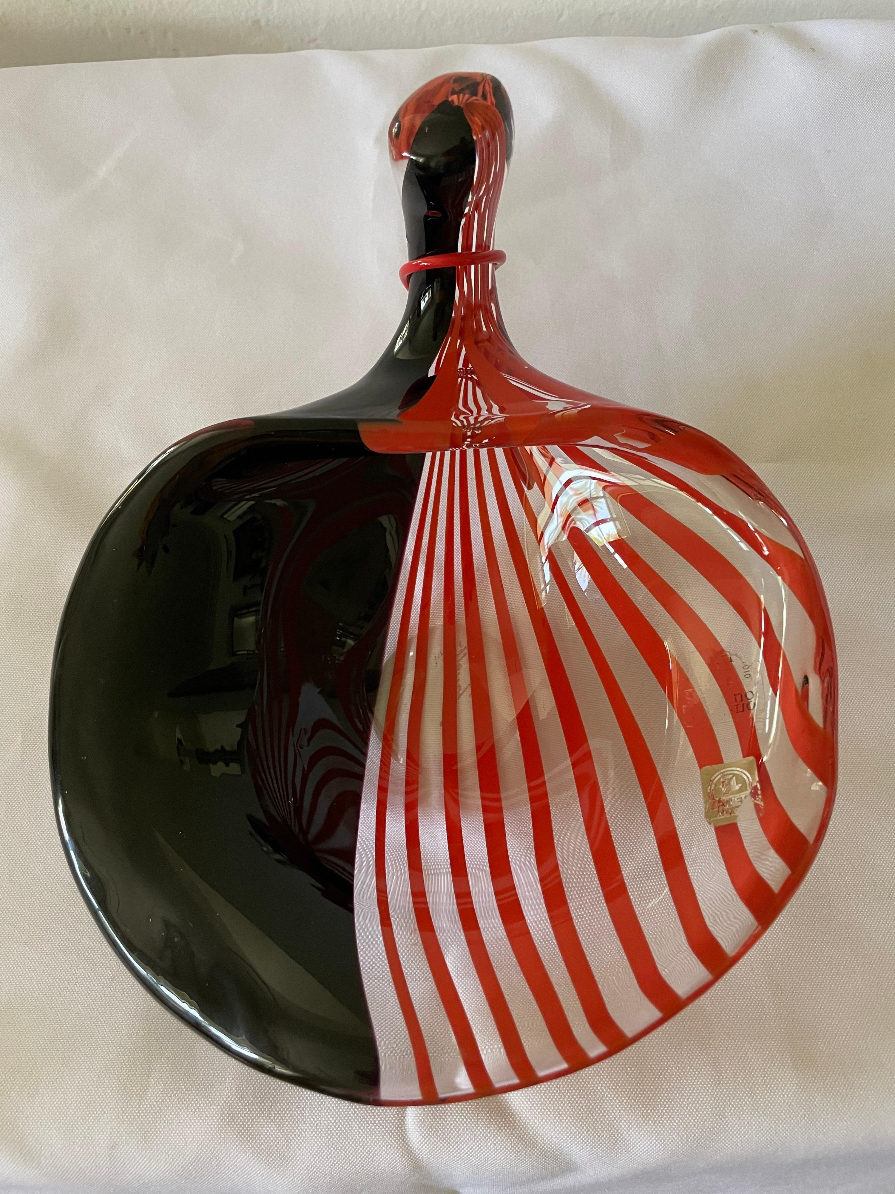 This extraordinarily well made large acanthus leaf design bowl with one half in rick black glass and the other half in coral red stripes. See all detail images to truly appreciate the perfection of this master artist family's pieces.