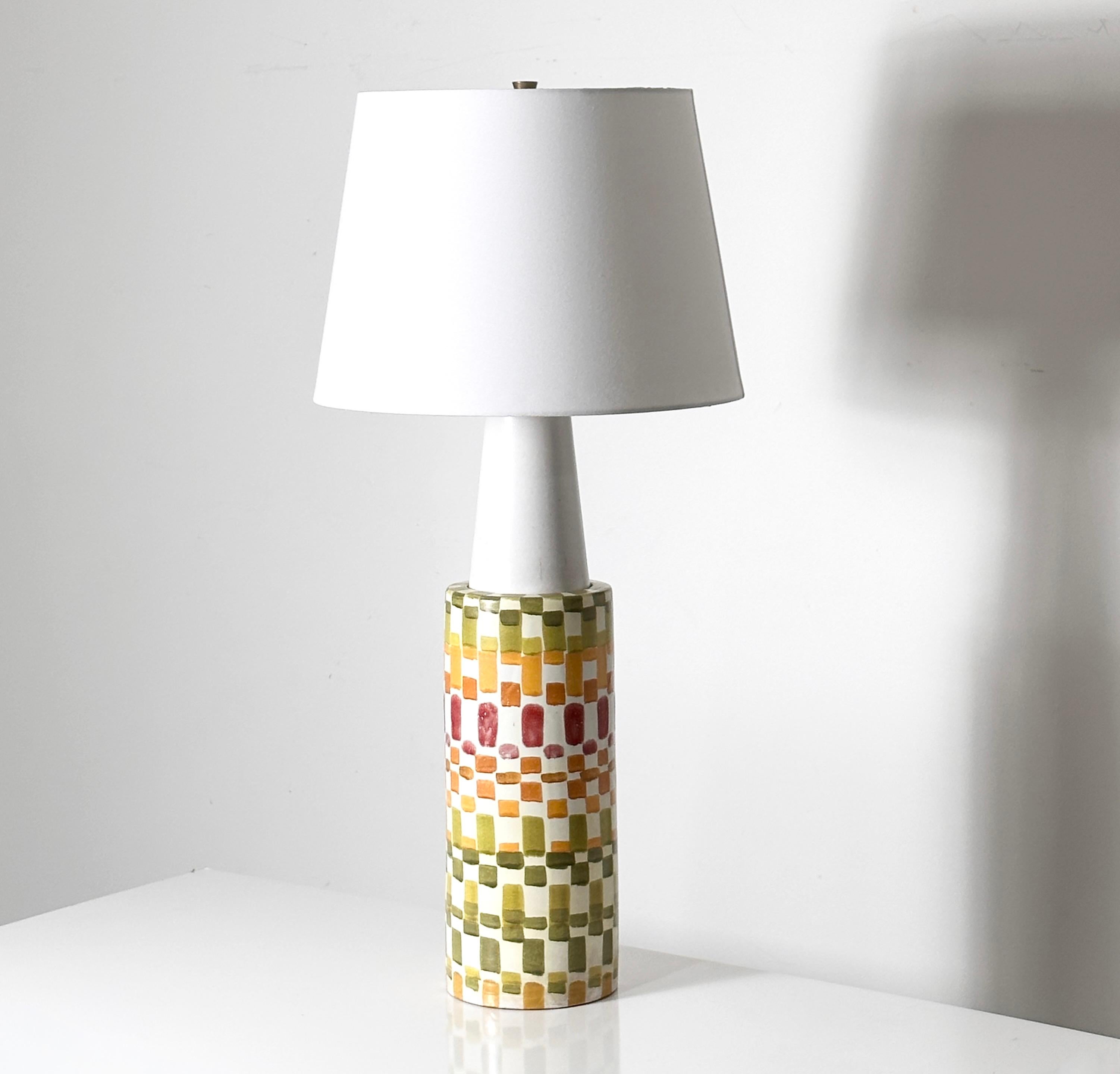 Massive and rare hand painted ceramic lamp by Aldo Londi for Bitossi 
circa 1960s
Colorful mosaic style glaze pattern with white conical apex
Signed to base