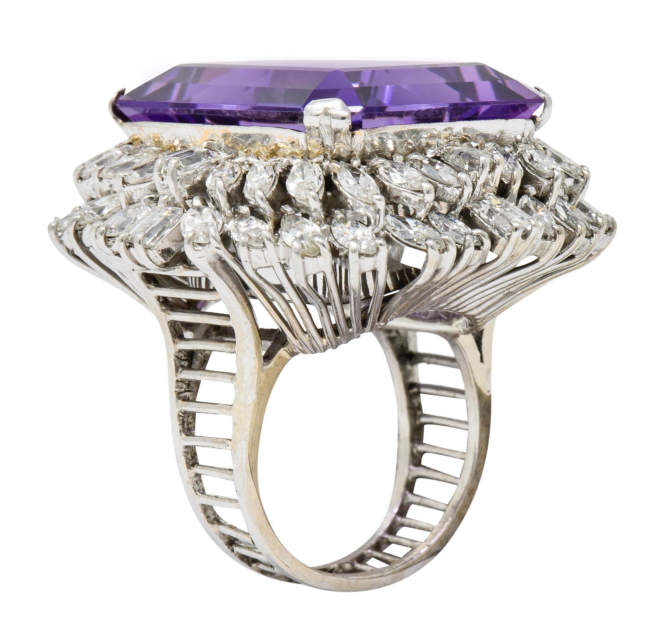 Centering a substantially sized emerald cut amethyst measuring approximately 22.7 x 19.7 mm

Remarkable purple in color with uniform distribution

Surrounded by a tiered double halo of marquise cut and baguette cut diamonds

Diamonds weigh in total