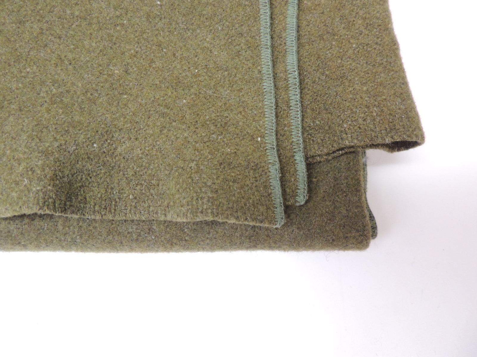 Army green wool blanket. (finished on all sides)
Reversible
Size: 63 W x 84 L.