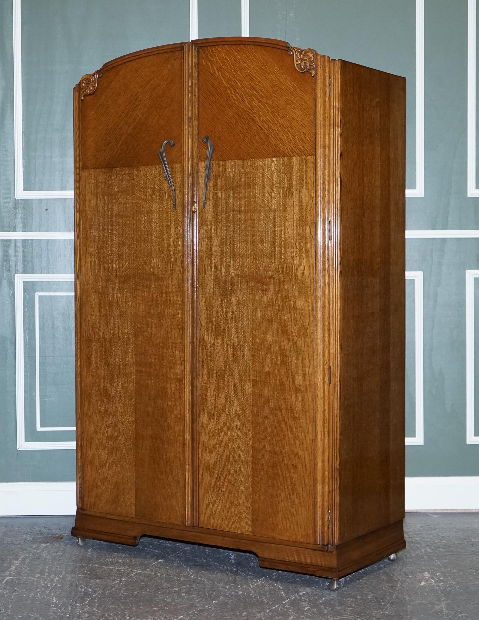 We are excited to offer for sale a large vintage art deco oak two-door wardrobe.

An art deco wardrobe made from oak.
It is lifted on castors which makes it easy to move if needed.
On the inside, it's designed to hang clothes with a little space