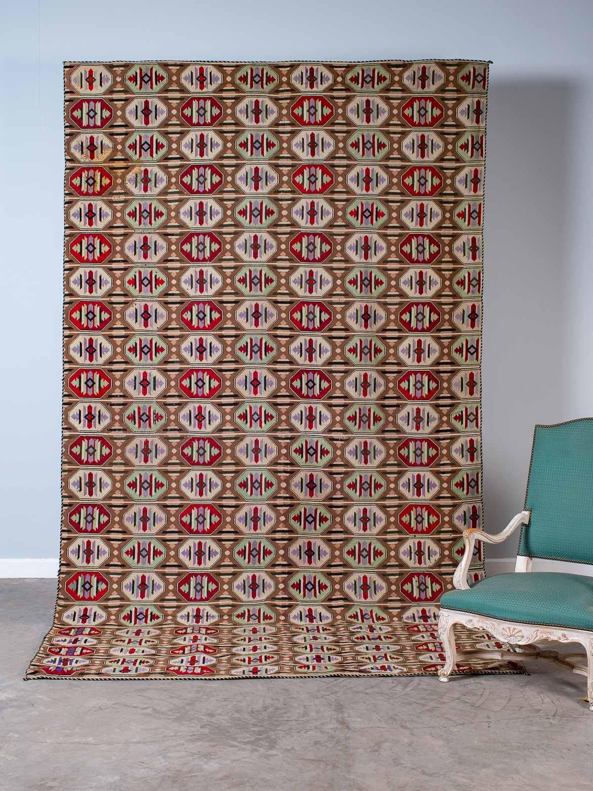 This enormous vintage Art Deco woven textile is from Prague in the Czech Republic, circa 1930. The combination of geometric designs with a powerful color palette gives this piece of woven art its visual impact. This textile is not a rug and was