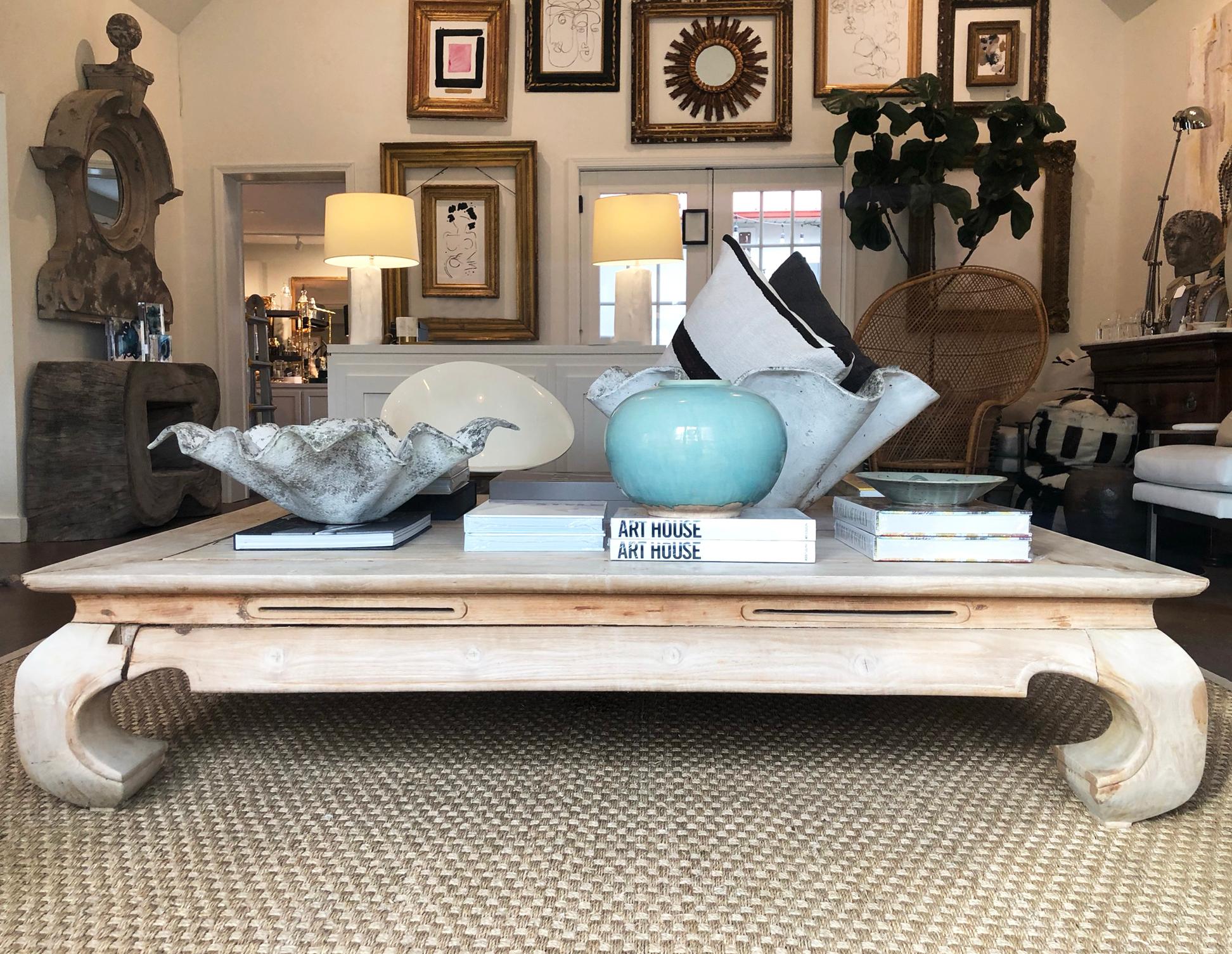 Beautiful and large vintage bleached coffee table in the Asian or Ming style. Beautiful hand carved chow style legs this statement piece can blend seamlessly in a modern or traditional home. It is full of character and has a beautiful soft color to