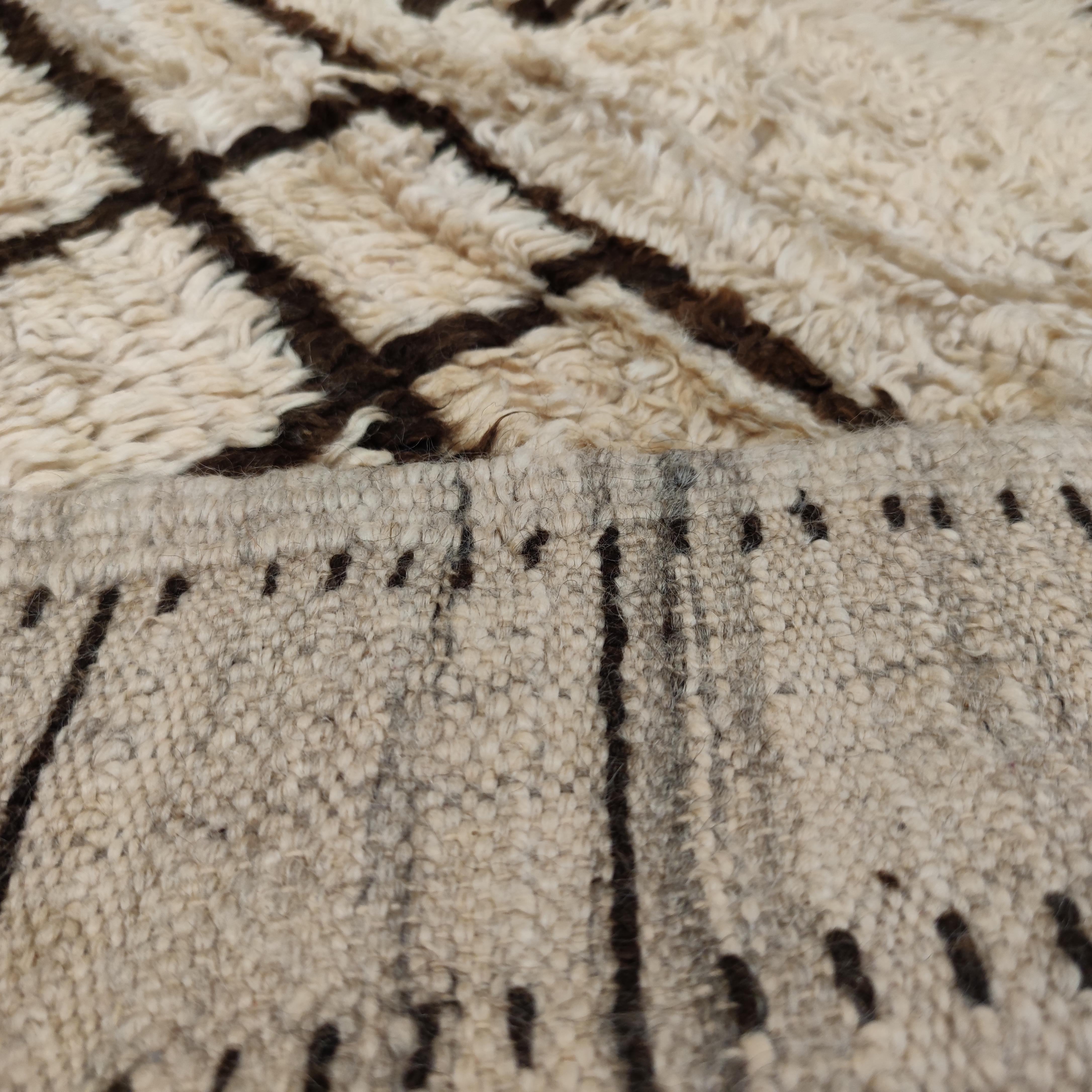 The rugs from the Azilal region, located in the Moroccan central High Atlas, have been a relatively recent discovery. Distinguished by abstract, quasi-calligraphic patterns often on an ivory background, they differ from the white ground Middle Atlas