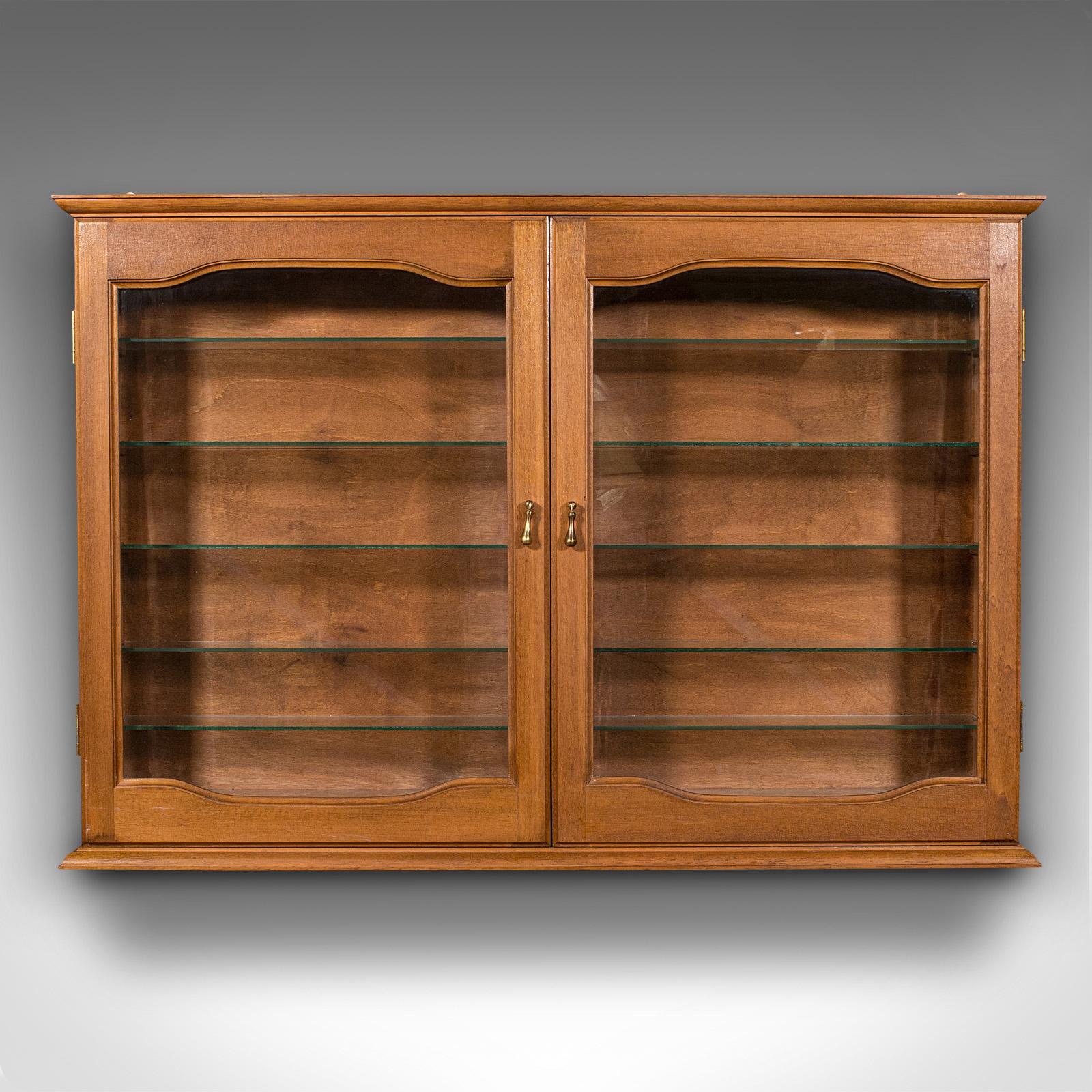This is a large vintage bespoke display cabinet. An English, mahogany and glass retail or collector's two-door 12 shelf showcase cupboard, dating to the late 20th century.

Presents beautifully and crafted to a high quality - superb for the Dinky