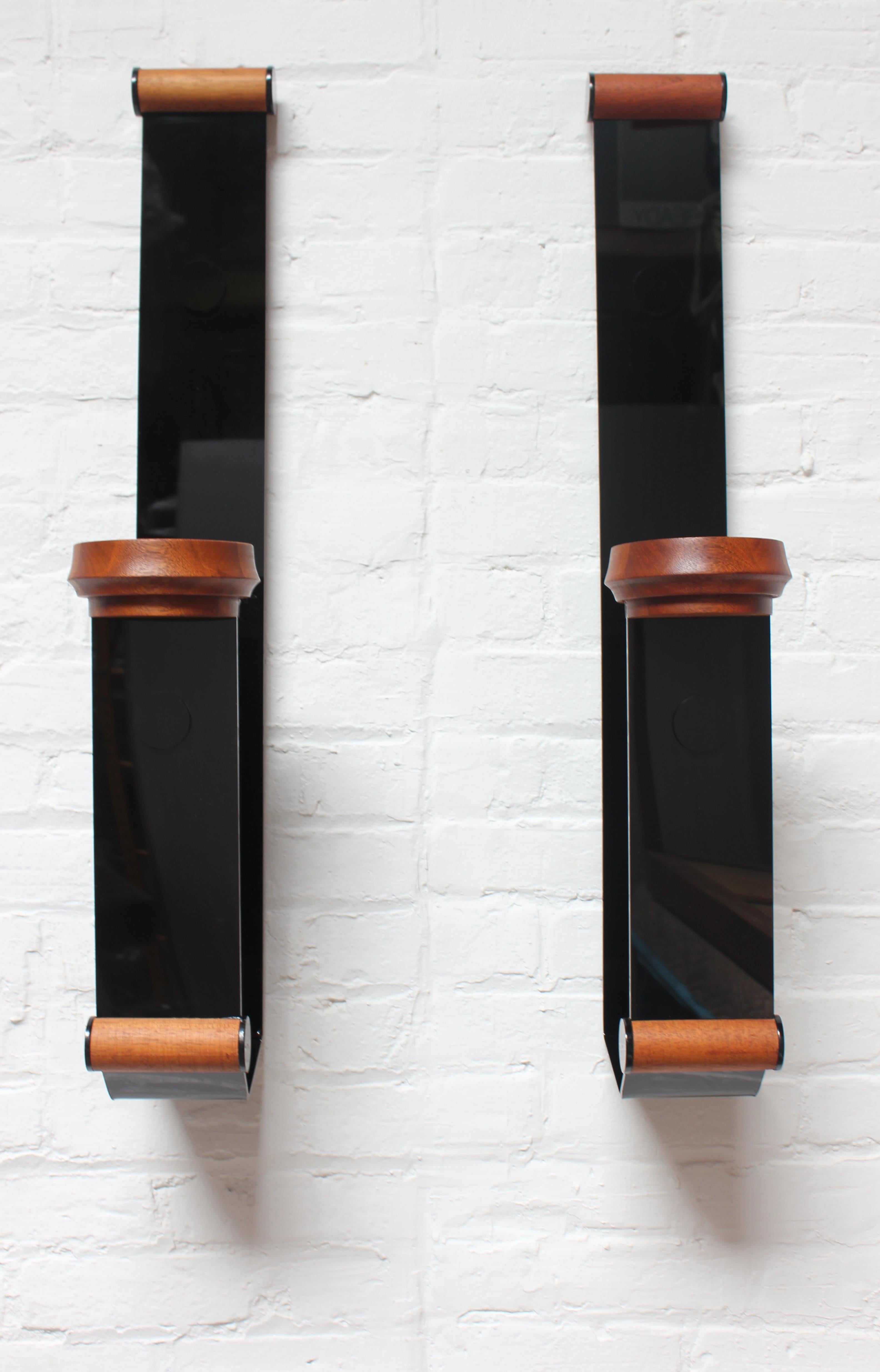 Unique pair of black acrylic candle holders / wall scones with teak holders (ca. 1970s).
Impressive size: H: 31