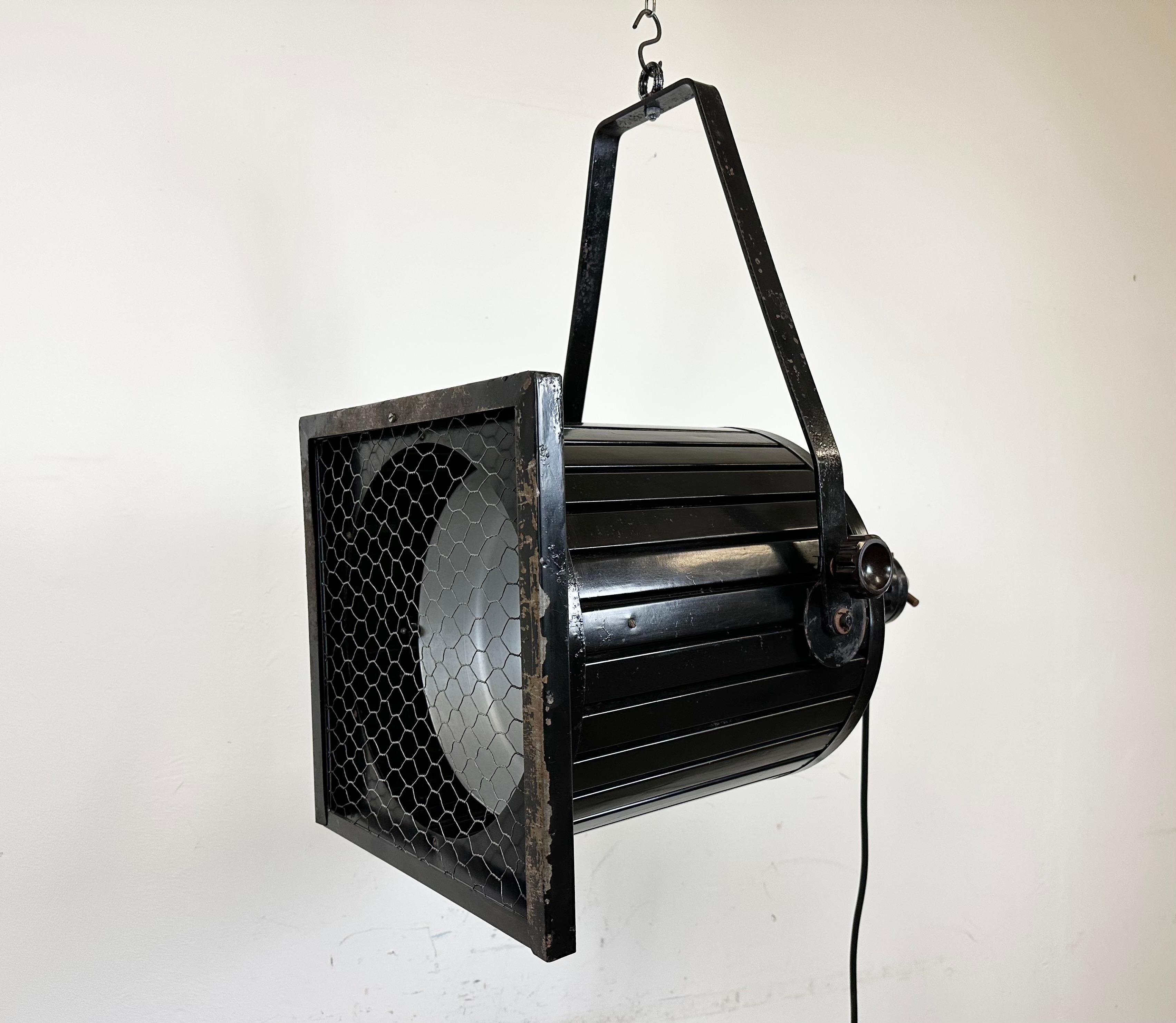 - Vintage theatre spotlight made in former Czechoslovakia during the 1960s 
- It features a black metal body and iron grid
- The porcelain socket requires standard E27/ E26 lightbulbs 
- New wire
-The height of the spotlight is 36 cm. With holder 67