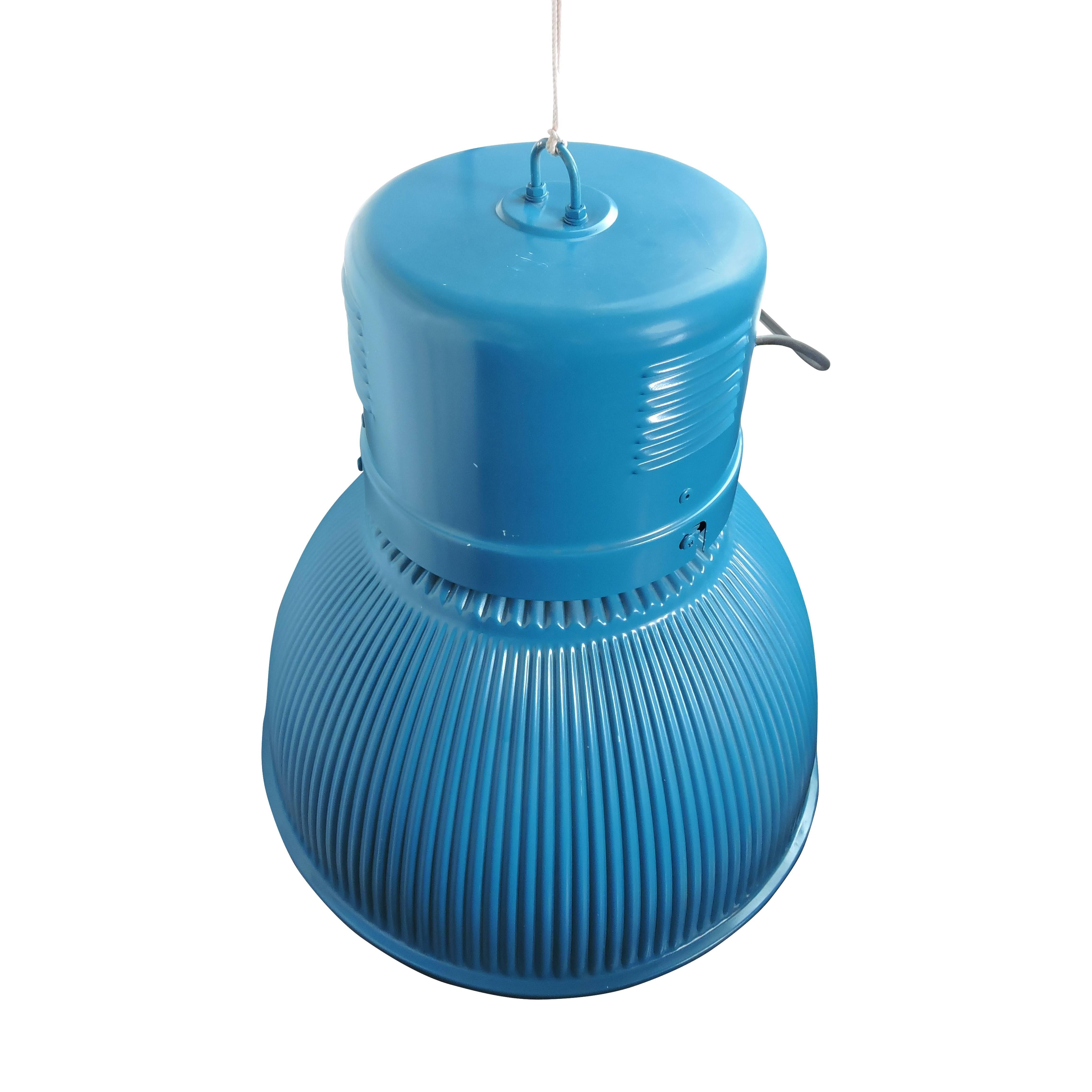 This roundish shaped hall lighting is thought to have originated from a factory's hanger. The light has a blue ribbed effect.