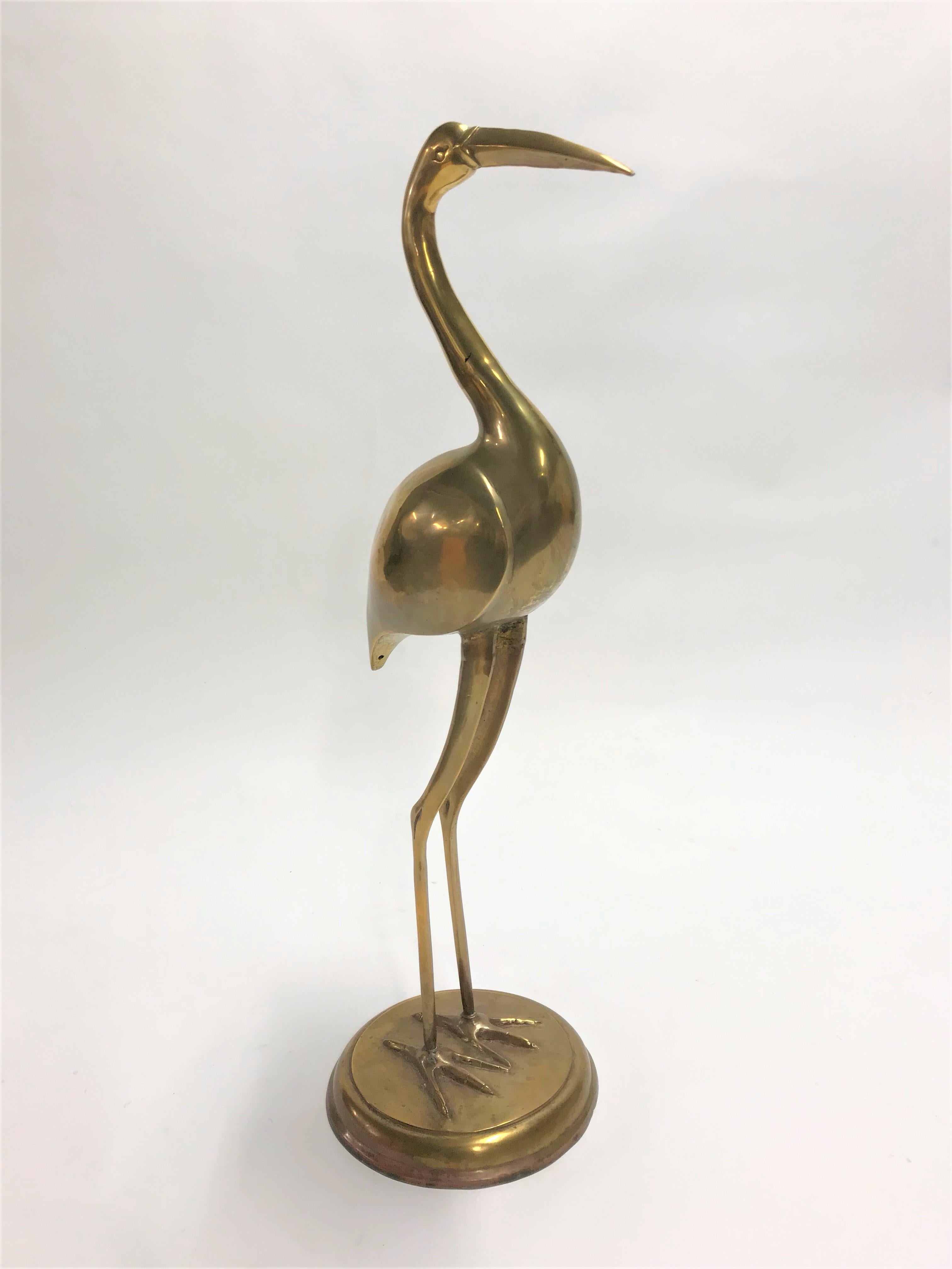 Large midcentury brass crane bird sculpture.

Good original condition, slightly patinated which adds to the charm.

Heavy quality item.

1970s, France

Good condition.

Dimensions:
Height 84 cm / 33