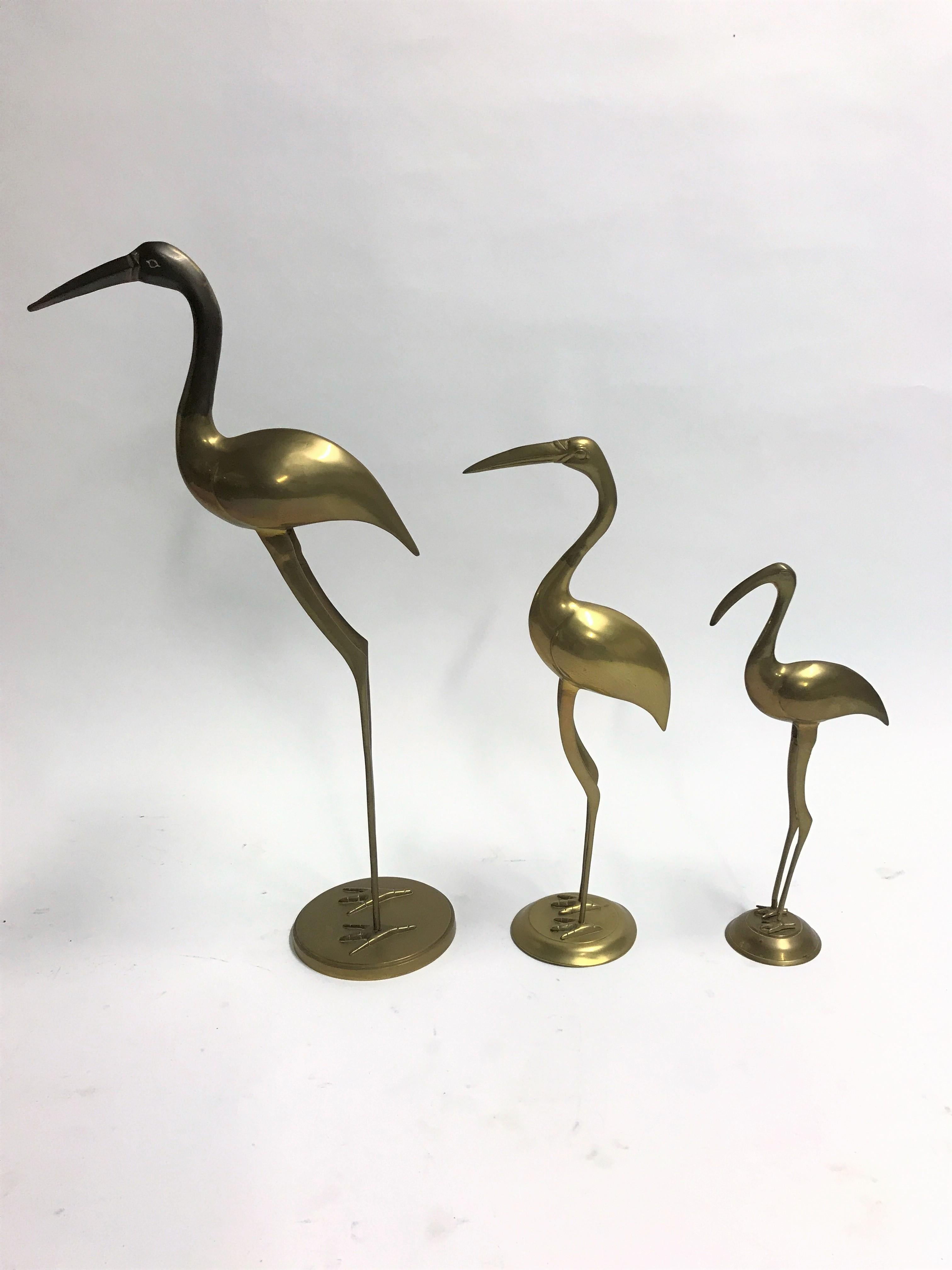 large brass cranes