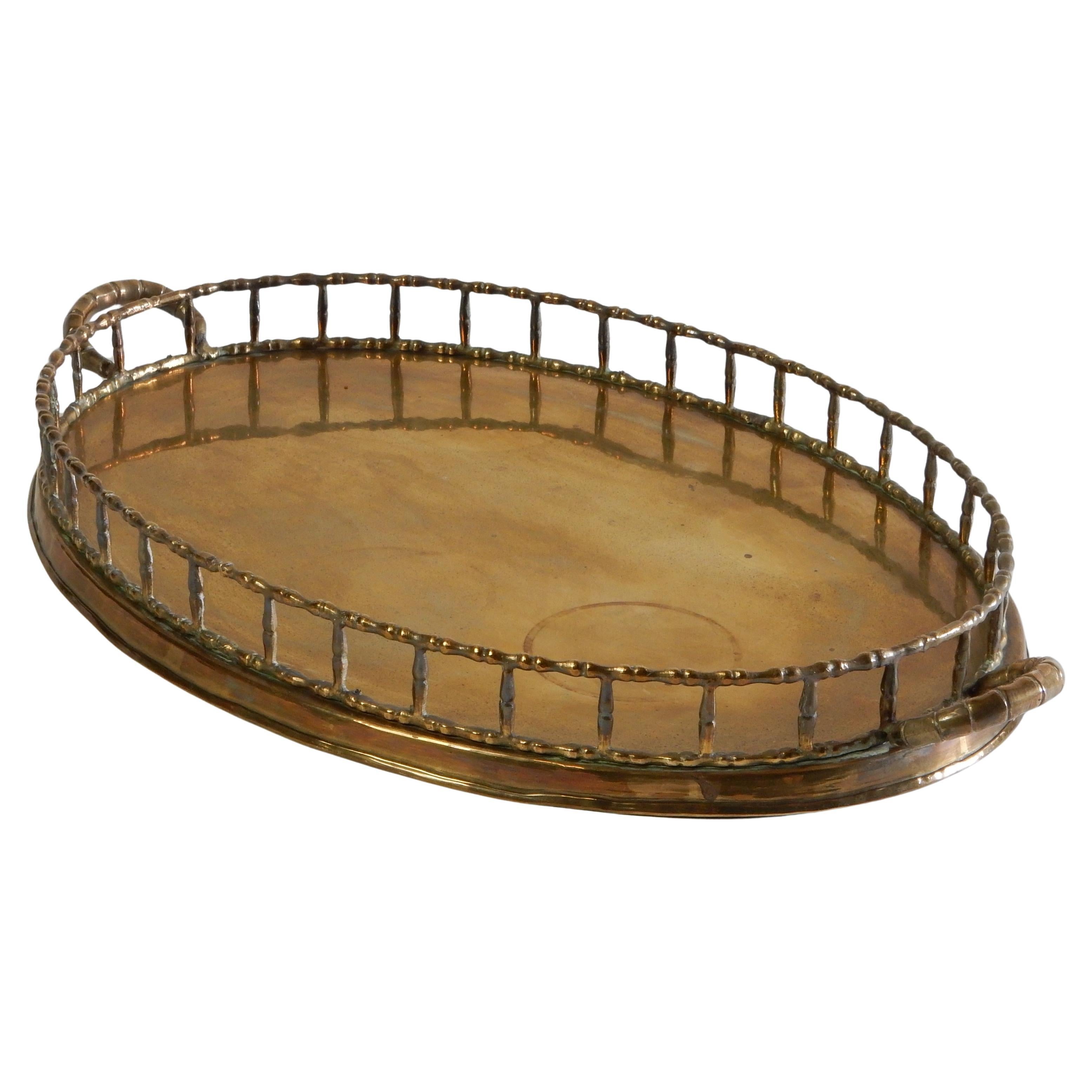 Large brass service tray with faux bamboo trim and handles.
Circa 1970's, Taiwan origin. Almost 2 feet long(23-1/2
