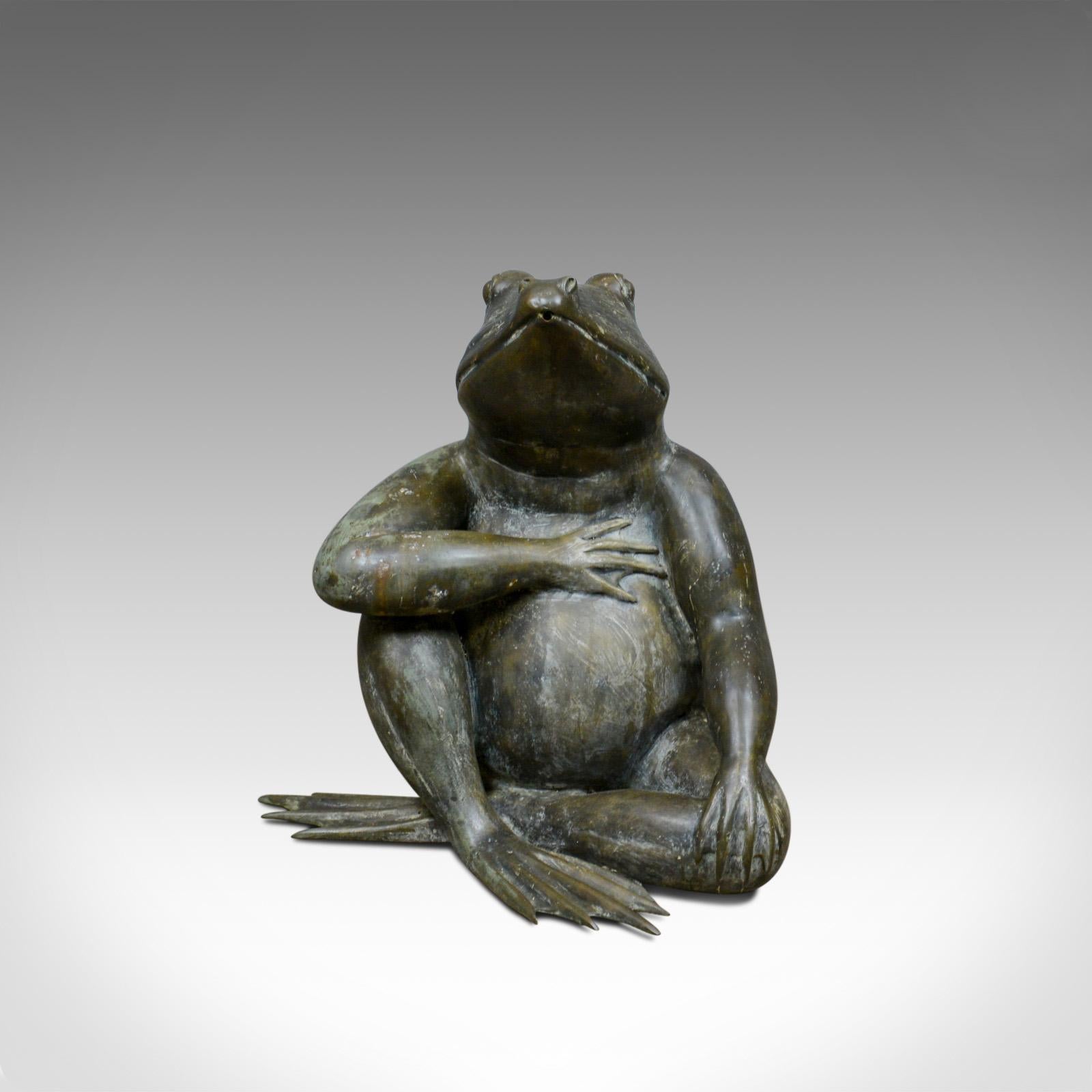 This is a large, vintage, bronze frog water feature. A decorative garden ornament dating to the 20th century.

Large, 0.5M (20 inches) high
Exceptional detail and presentation
Beautifully patinated bronze
Sat, legs crossed in casual