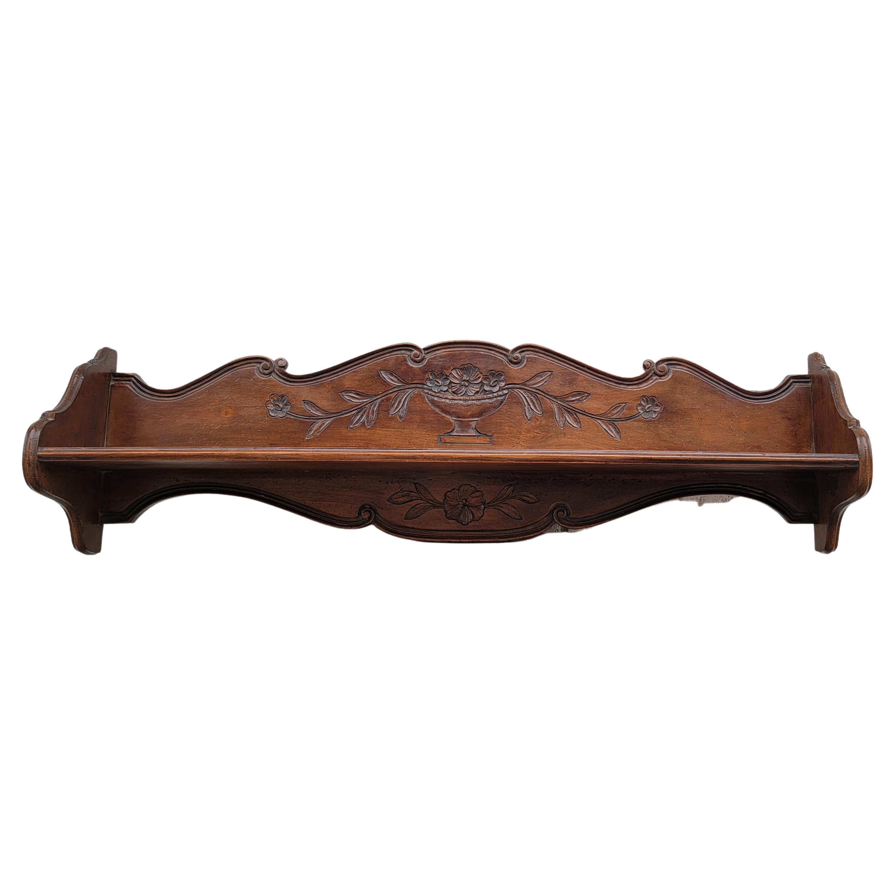 Large 47 inches Vintage, hand carved walnut French wall shelf. 
Numbered item made in France exclusively for Bloomingdale in the 1960s. 
Very good vintage condition.
Measures 47.25