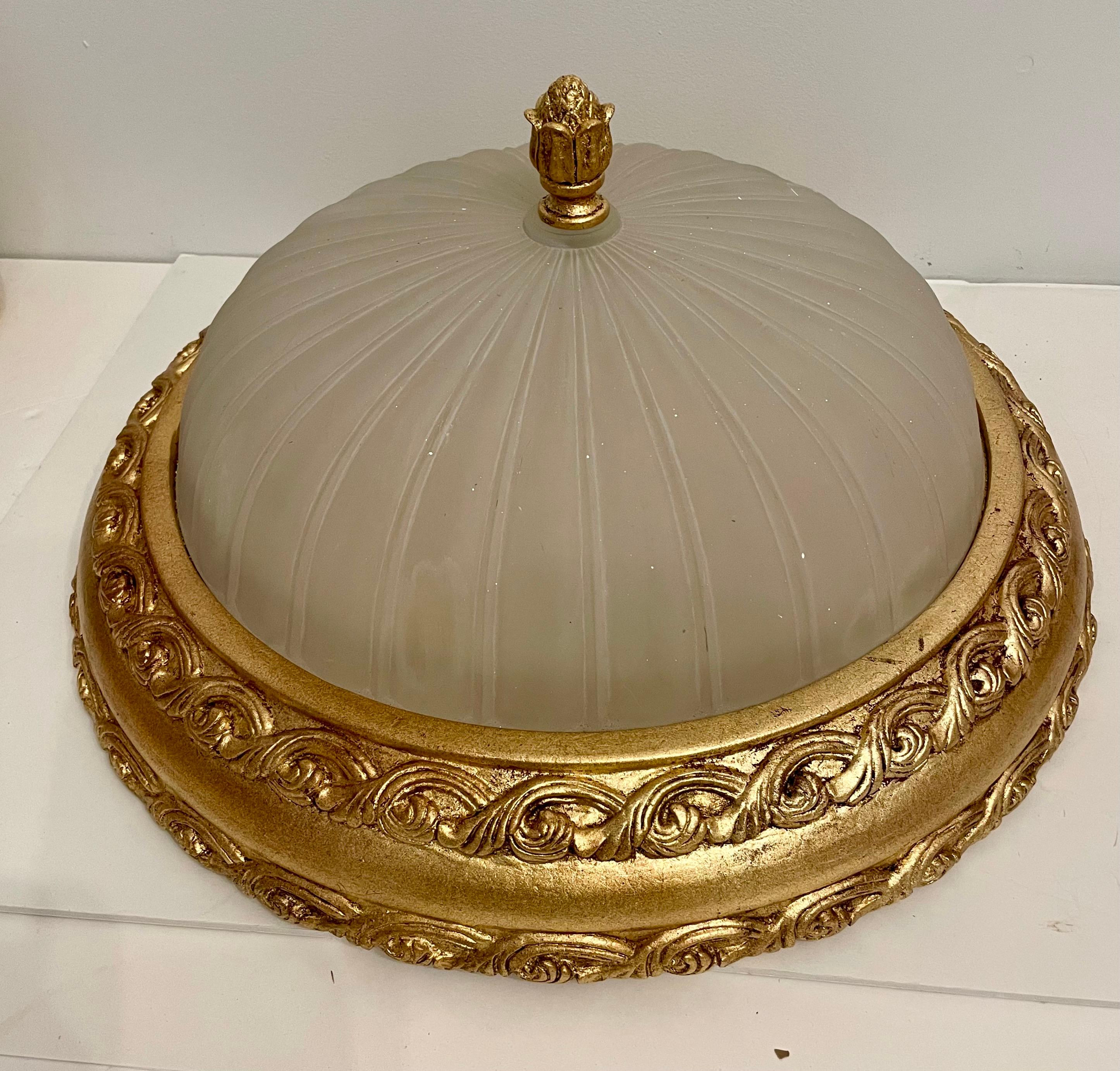Large Scale Vintage Cast Gilt Finish Flush Mount Chandelier with deep ribbed frosted art glass shade, with three medium base sockets.  Ribbed glass shade is 15.5