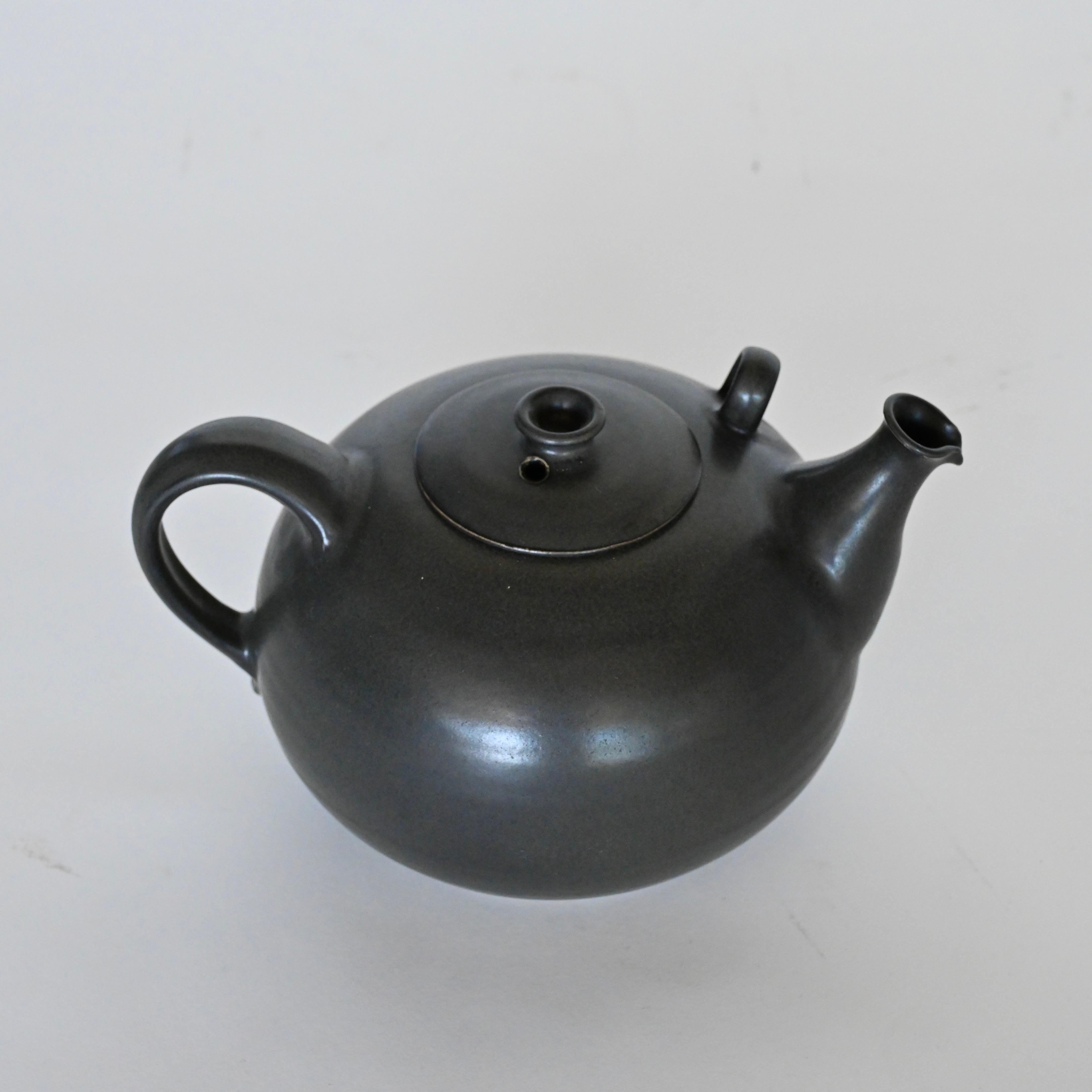 Beautiful large vintage ceramic tea pot. Marked and numbered at base. Designer and year unknown. 