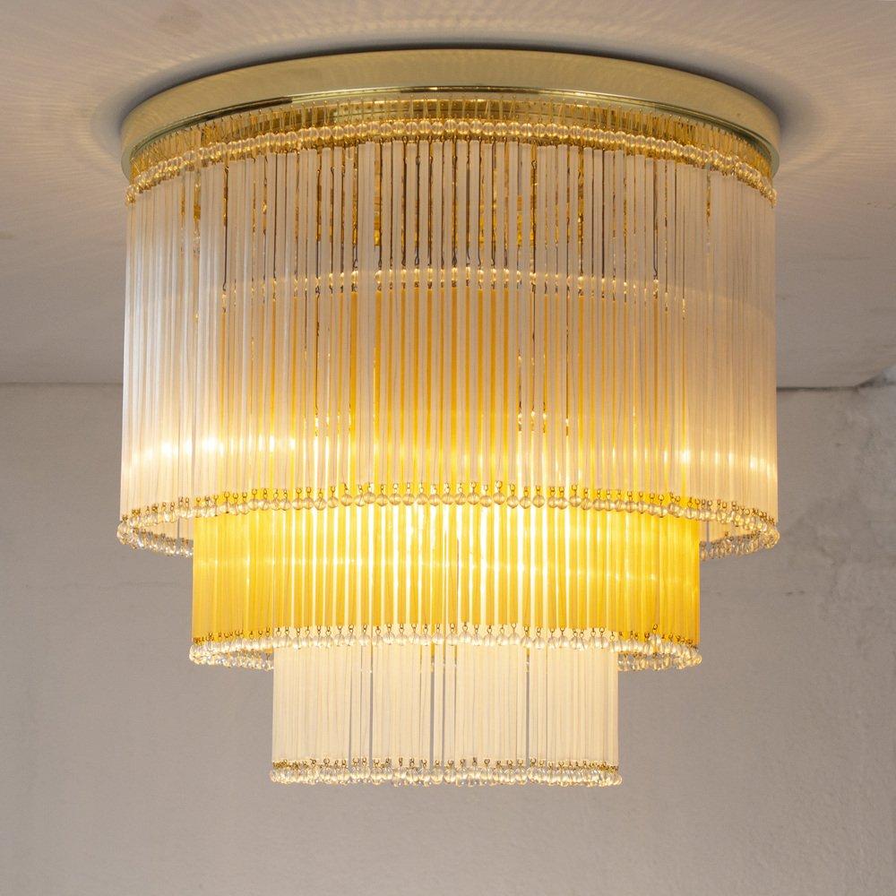 Ceiling lamp chandelier diameter Ø45 cm with glass canes and pearl Made in Italy in silk and ivory colored Murano glass.

Additional information:
Material: Glass, Metal, Murano Glass
Design period: 1990 - 1999
Bulbs: 7 Lights 110 V USA / 220 V EU
