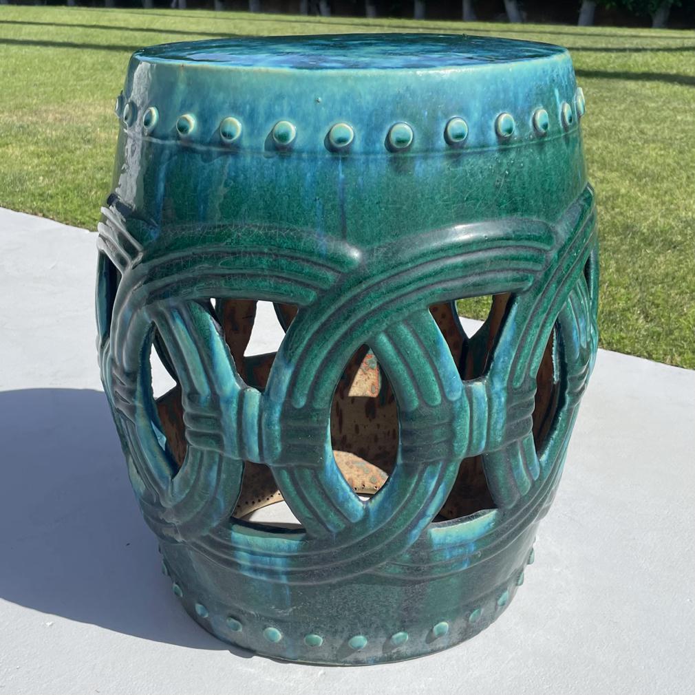 Large Vintage Chinese Ceramic Garden Stool. 
Classic drum/barrel form with overlapping coin cutouts in a larger then typical scale, covered overall in a thick copper green glaze. 
Minor signs of age and wear otherwise fine condition. 
Jiangxi