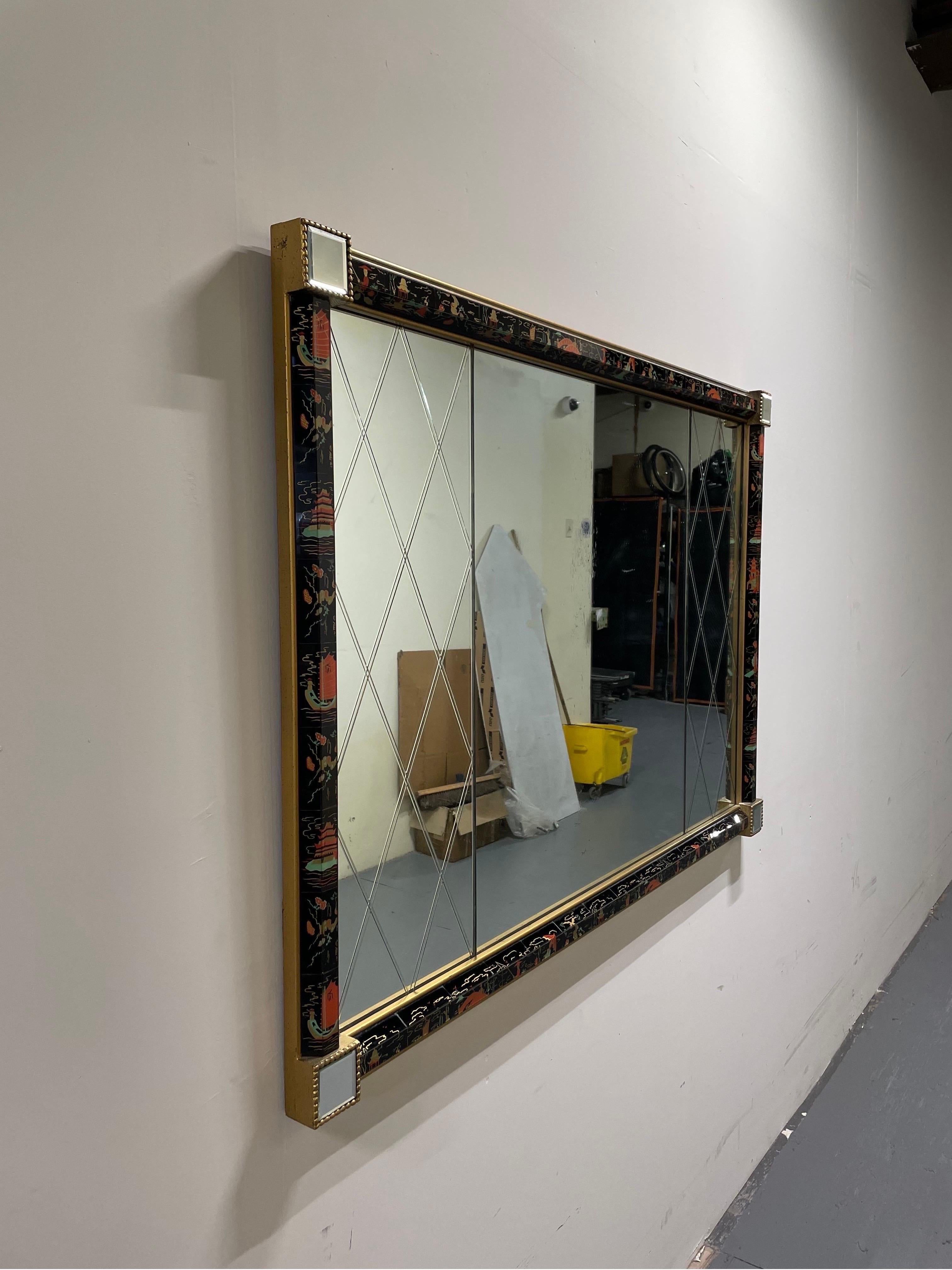 Spectacular eglomise mirror. Harlequin side panels flank center mirror with natural antiquing finish. All boarders with half hex reverse painted panes capped with mirrors corner. WOW
Curbside to NYC/Philly $300