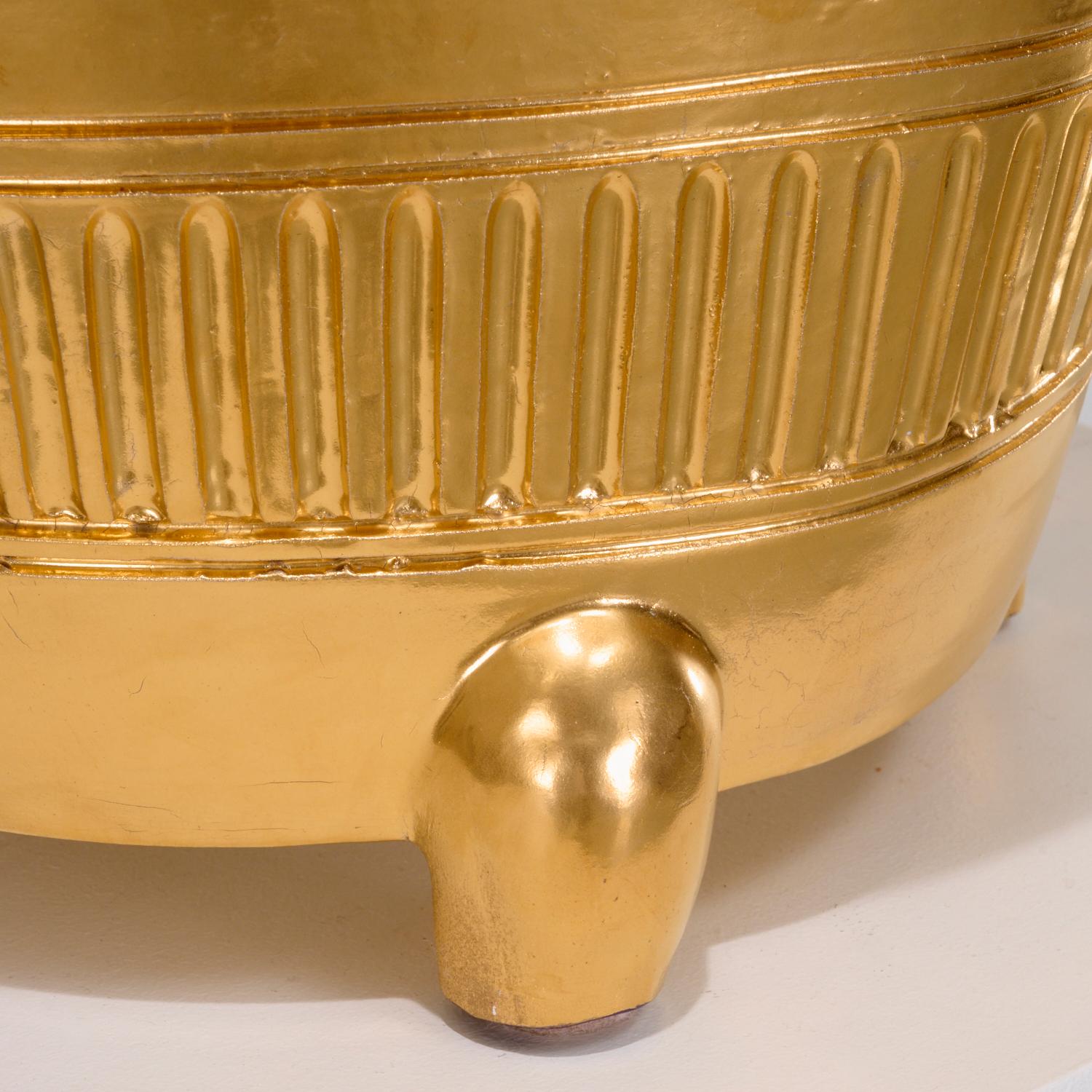 20th c., France, a large Dior Home jardinière. A richly gilt exterior, with fluted banding along body, on four modernistic feet, signed 