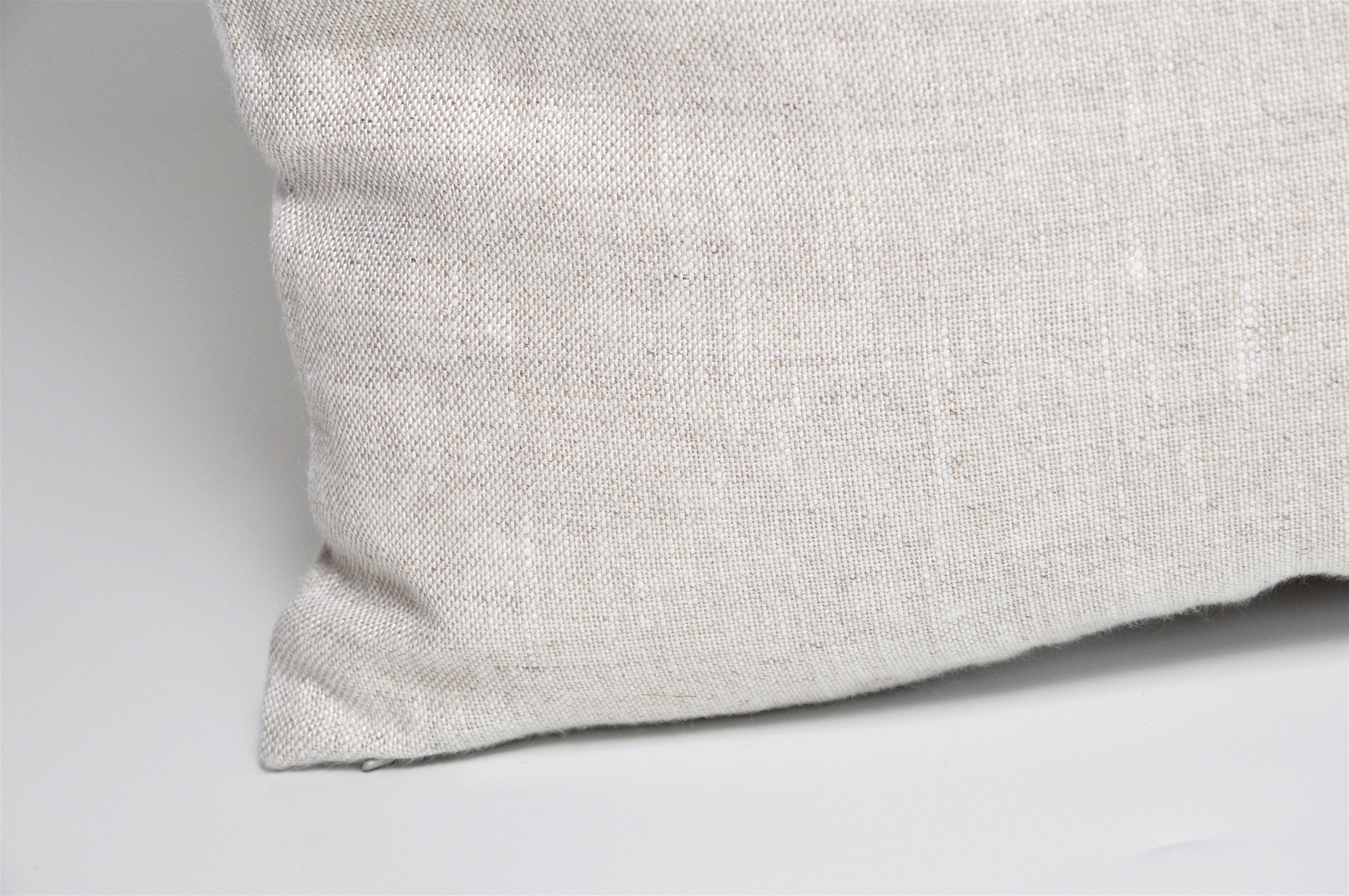 This cushion is a one-of-a-kind and part of a sustainability project. 
It has been created from an up-cycled, recycled luxury fabric, used with the intentions of promoting a more eco-friendly environment by using already existing materials. We both