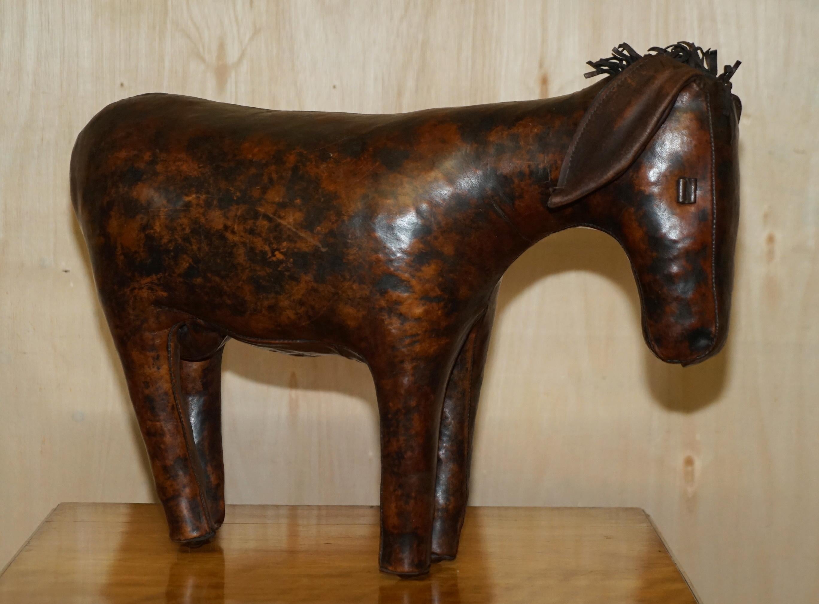 We are delighted to offer for sale this absolutely sublime circa 1940's Abercrombie & Fitch Omersa brown leather hand dyed Donkey or Pony footstool.

These come in varying sizes there is a medium size which is perfect for one person to use as a