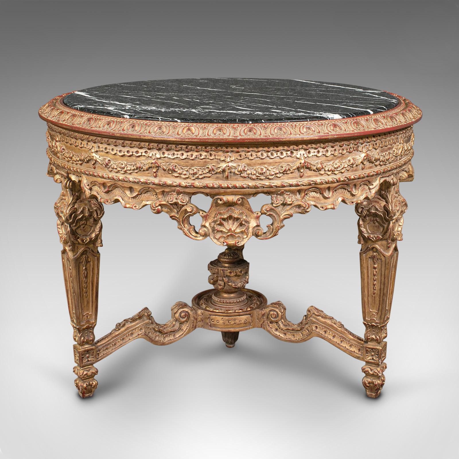 This is a grand vintage circular table. A Continental, giltwood and marble centrepiece table in Rococo revival taste, dating to the late 20th century, circa 1980.

An alluring statement piece for lovers of the flamboyant
Displays a desirable aged