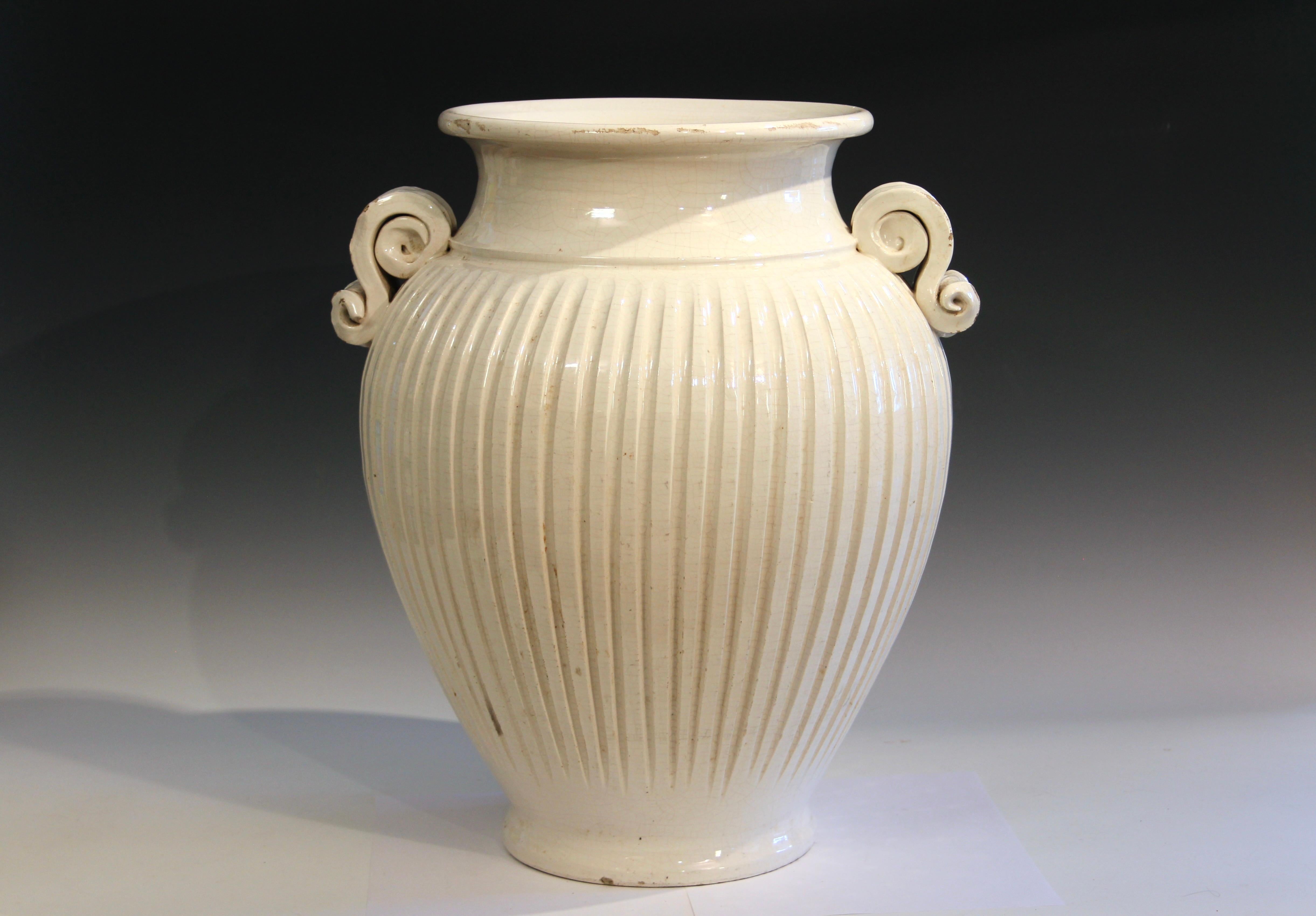Large vintage hand turned Italian pottery vase with fluted sides and S-form handles. Classical Italian urn form. Great looking piece. Circa late 20th century. 18