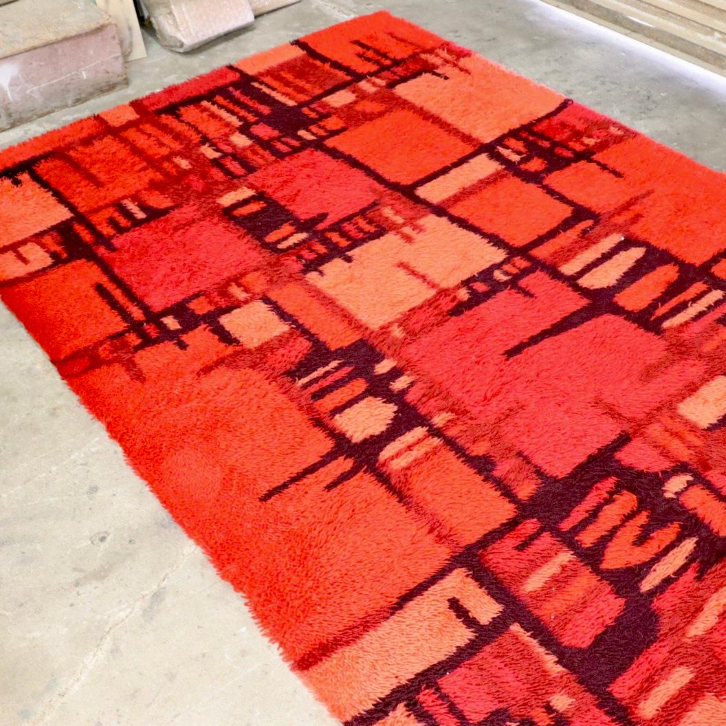 Beautiful traditional Danish Rya rug with vibrant hues color. Wonderful geometric abstract design traditional of Rya rugs. We are unsure of who designed this piece but we are sure this rug will make any room and vibrant and wonderful place to be.
