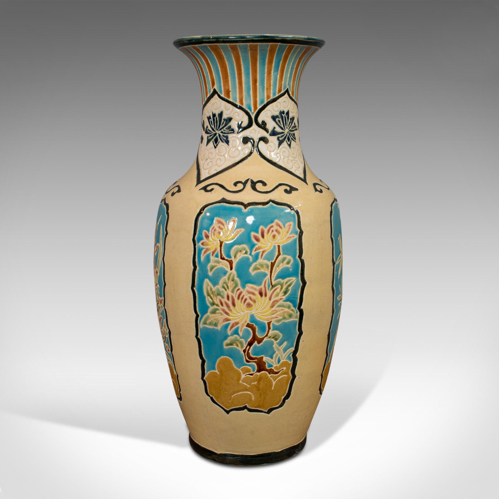 This is a large vintage decorative vase. An oriental, ceramic urn or hallway stick stand, dating to the late 20th century, circa 1980.

Vibrant palette and appealing panel decoration
Displays a desirable aged patina
Ceramic in good order, free