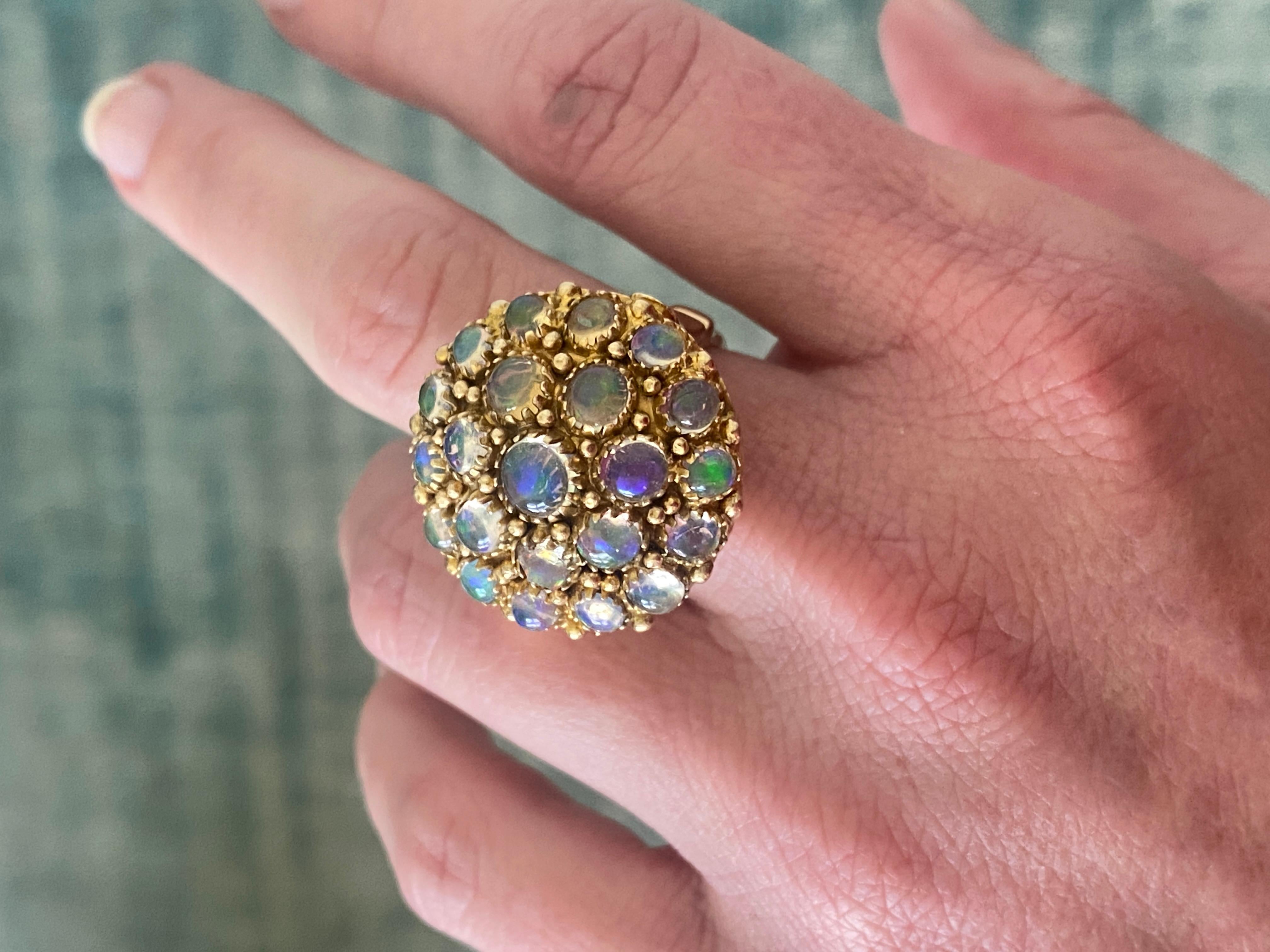 Large Vintage, Domed 14K Yellow Gold Multi-Opal Round Cocktail Statement Ring. Opal stones are round and oval and bezel set throughout ring. Sure to be a stunner day or night.
Free shipping anywhere in the US.