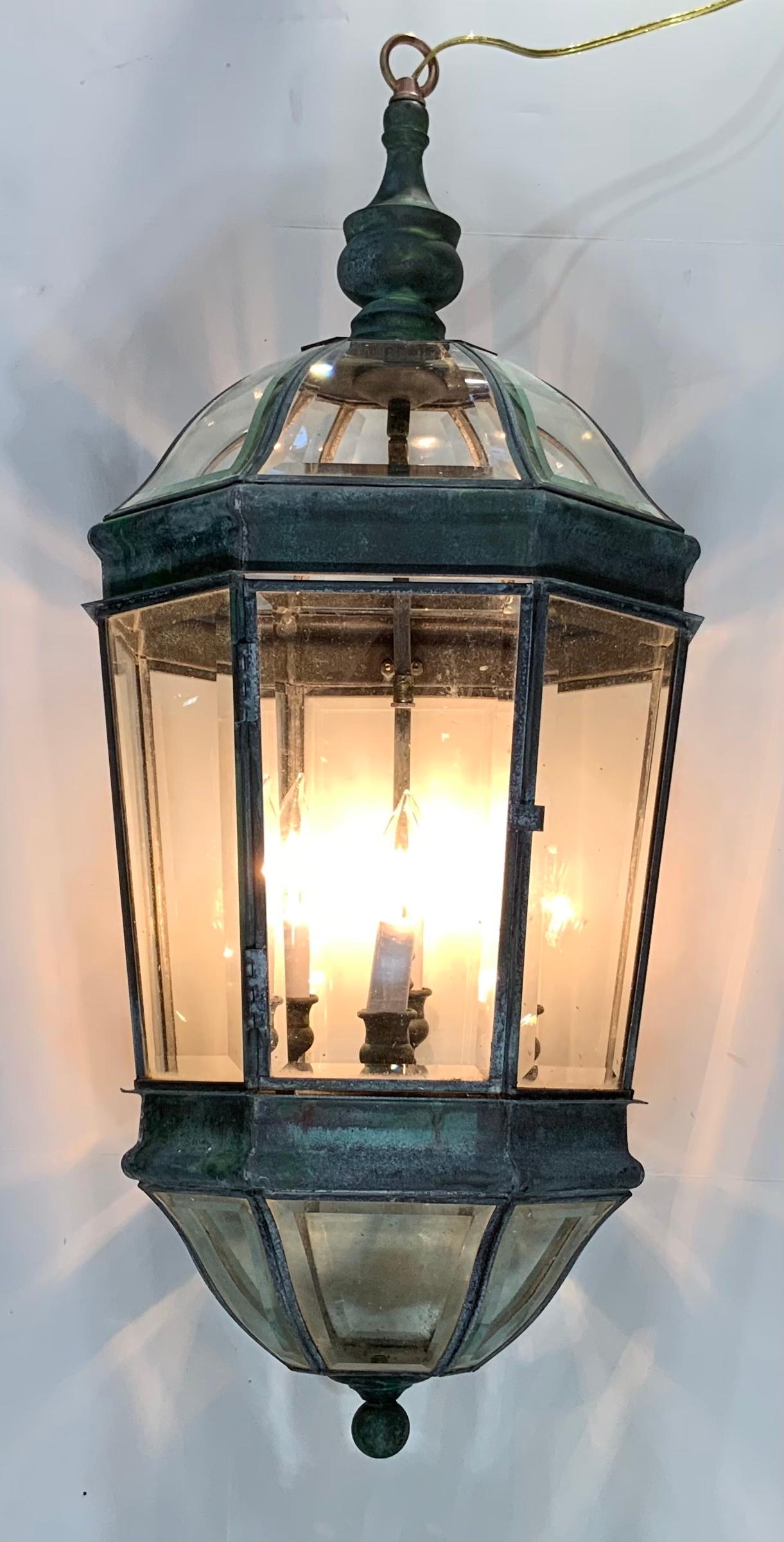 Elegant handcrafted lantern made of solid brass, open glass top and bottom give dramatic light exposure, with beveled glass all over.
Electrified with Four 40/watt lights, good for wet locations, although could be used also as decorative indoor