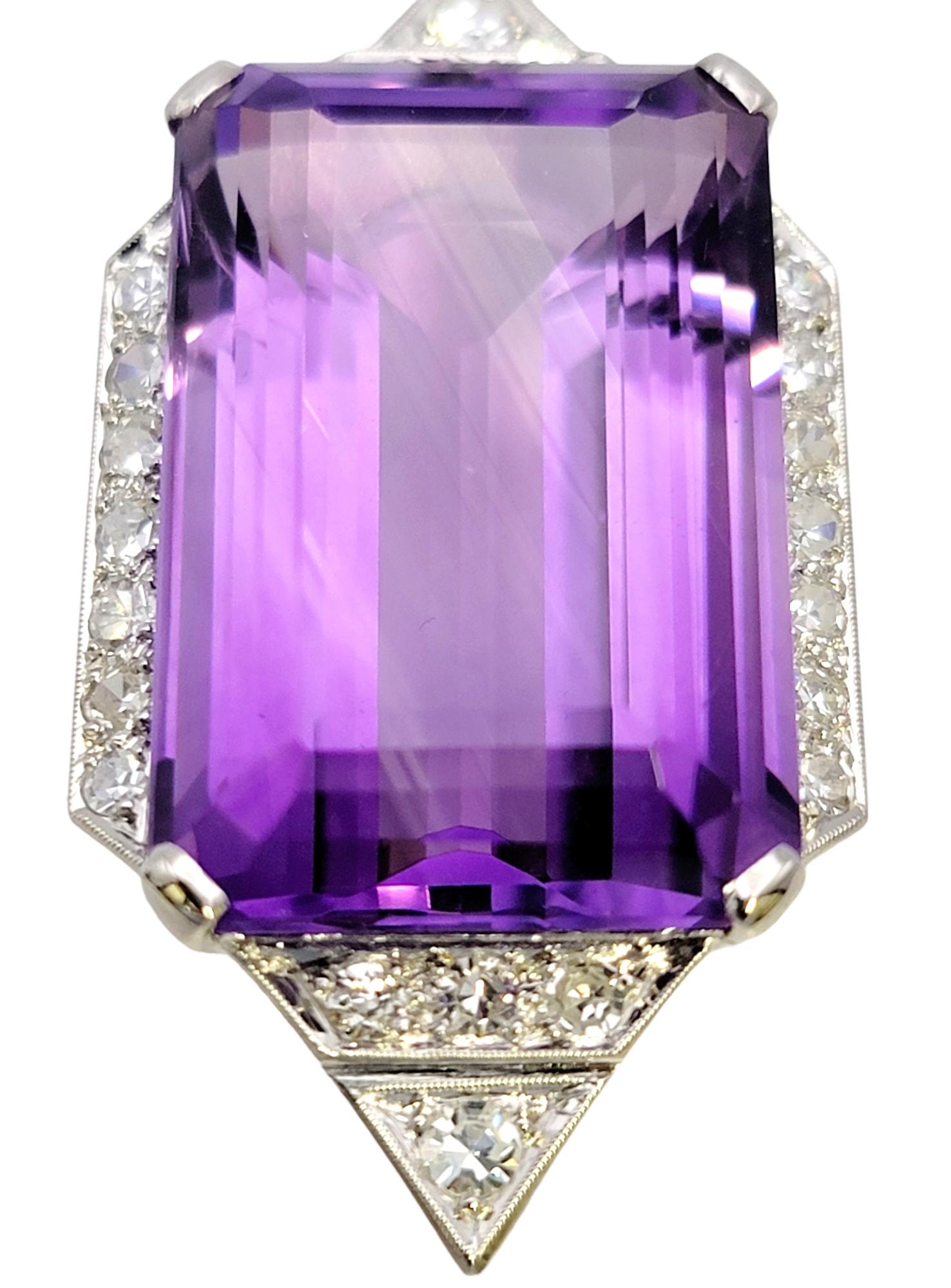 Elevate your jewelry collection with this breathtaking vintage lady's pendant featuring a magnificent large emerald-cut amethyst and dazzling diamonds. Crafted in lustrous platinum, this exquisite piece exudes timeless beauty and sophistication.