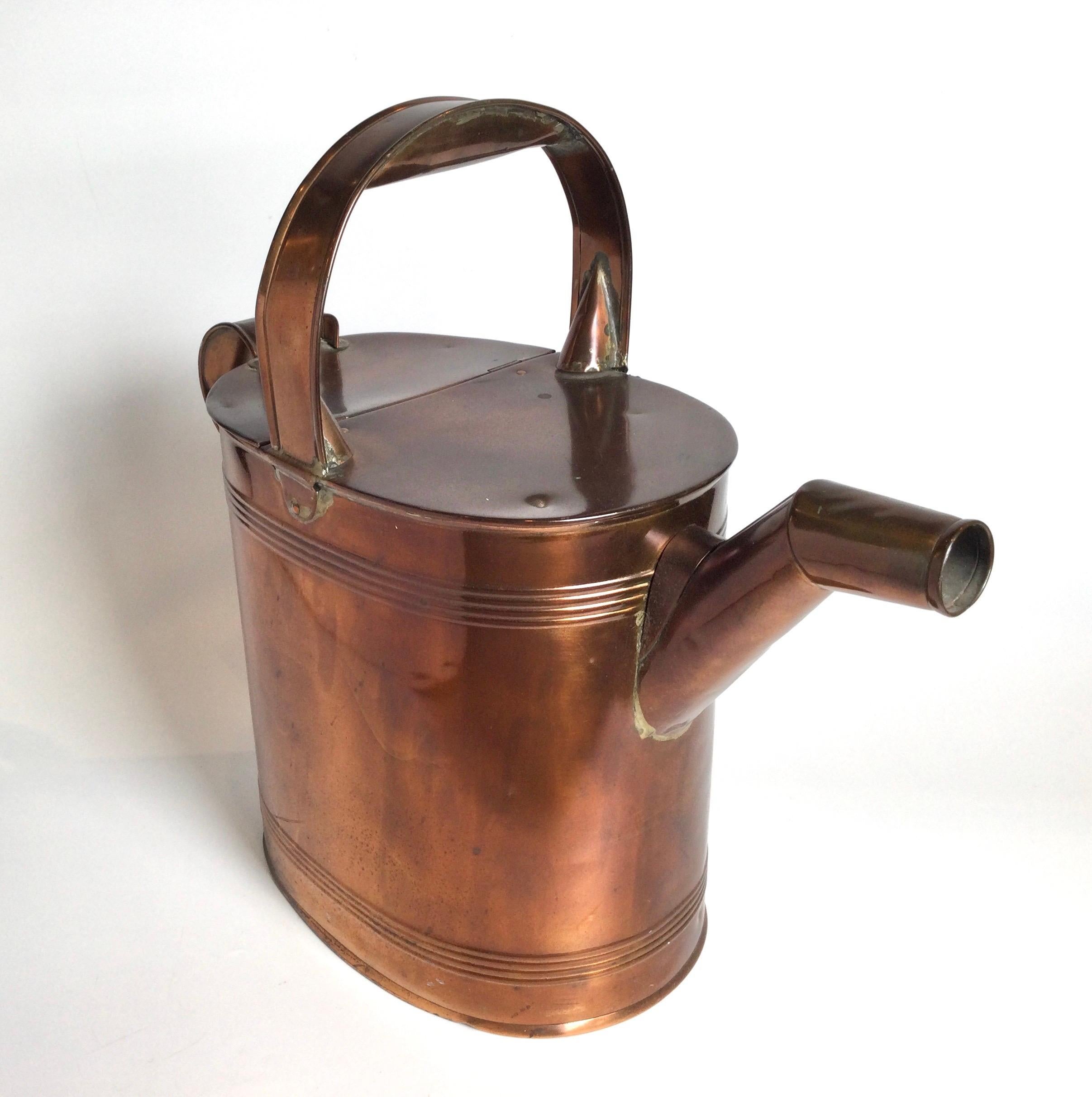 A large and well designed function watering can, made in England, 1950 spout to handle, 19 inches, height to handle is 17 inches.