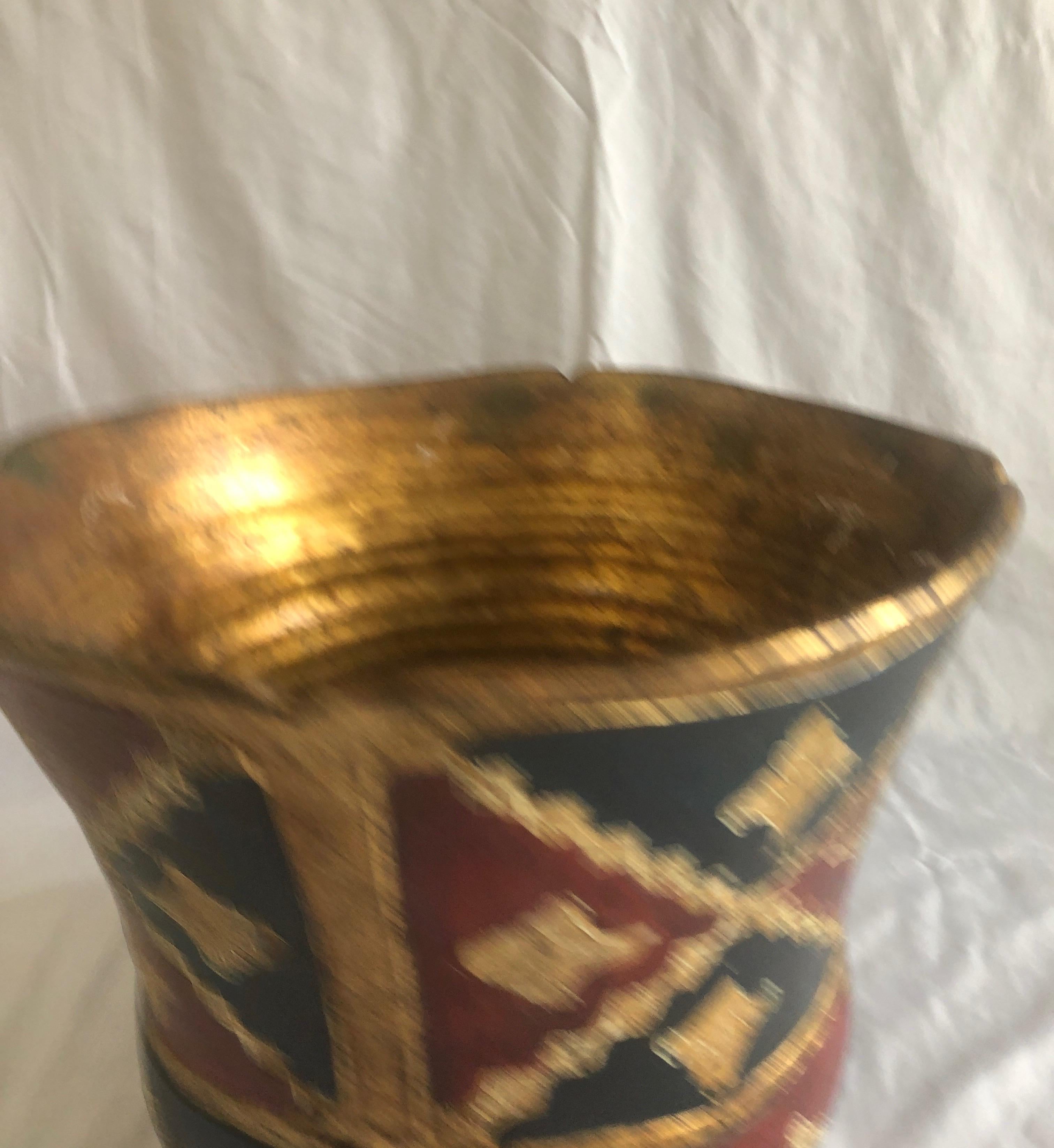 Large vintage Florentine terracotta hand painted planter.
Red, blue and gold pot. (Jardinière)
Footed base and finished inside too.
Size: 15” W x 12” H x 8” D base.