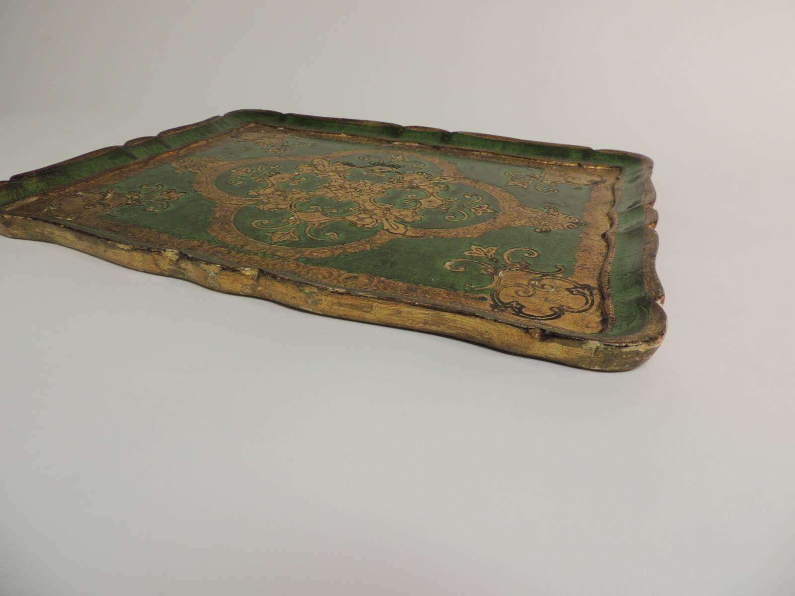 Large vintage Florentine wood painted tray
Italian gold leaf and Kelly green wood serving tray. Stamped: FLORENCE, Italy.
Size: 18 x 14.5 x 1.

 