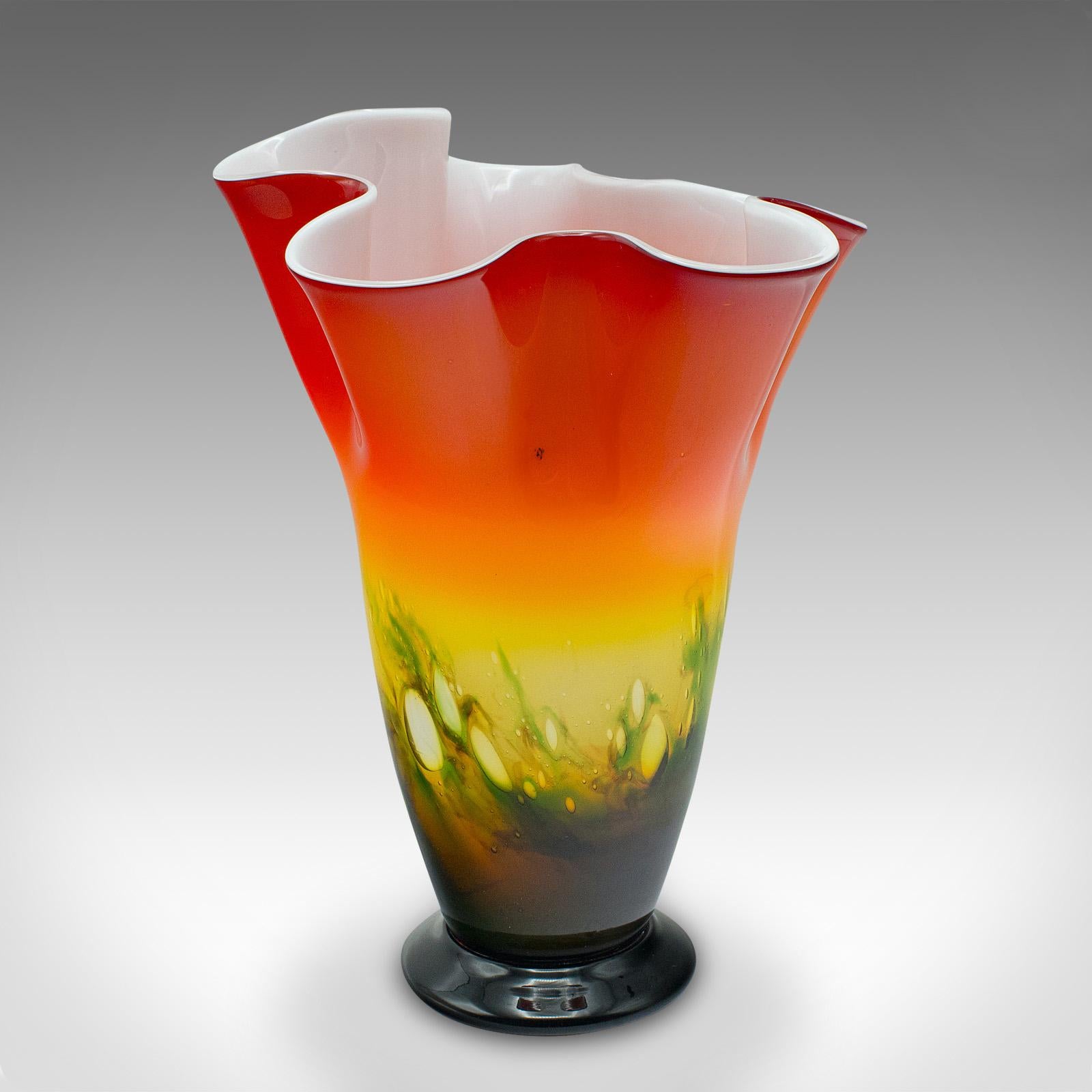 This is a large vintage flower vase. An Italian, Murano art glass decorative planter, dating to the late 20th century, circa 1970.

Riotous colour across a distinctive, rebellious form
Displays a desirable aged patina and in good order
Quality