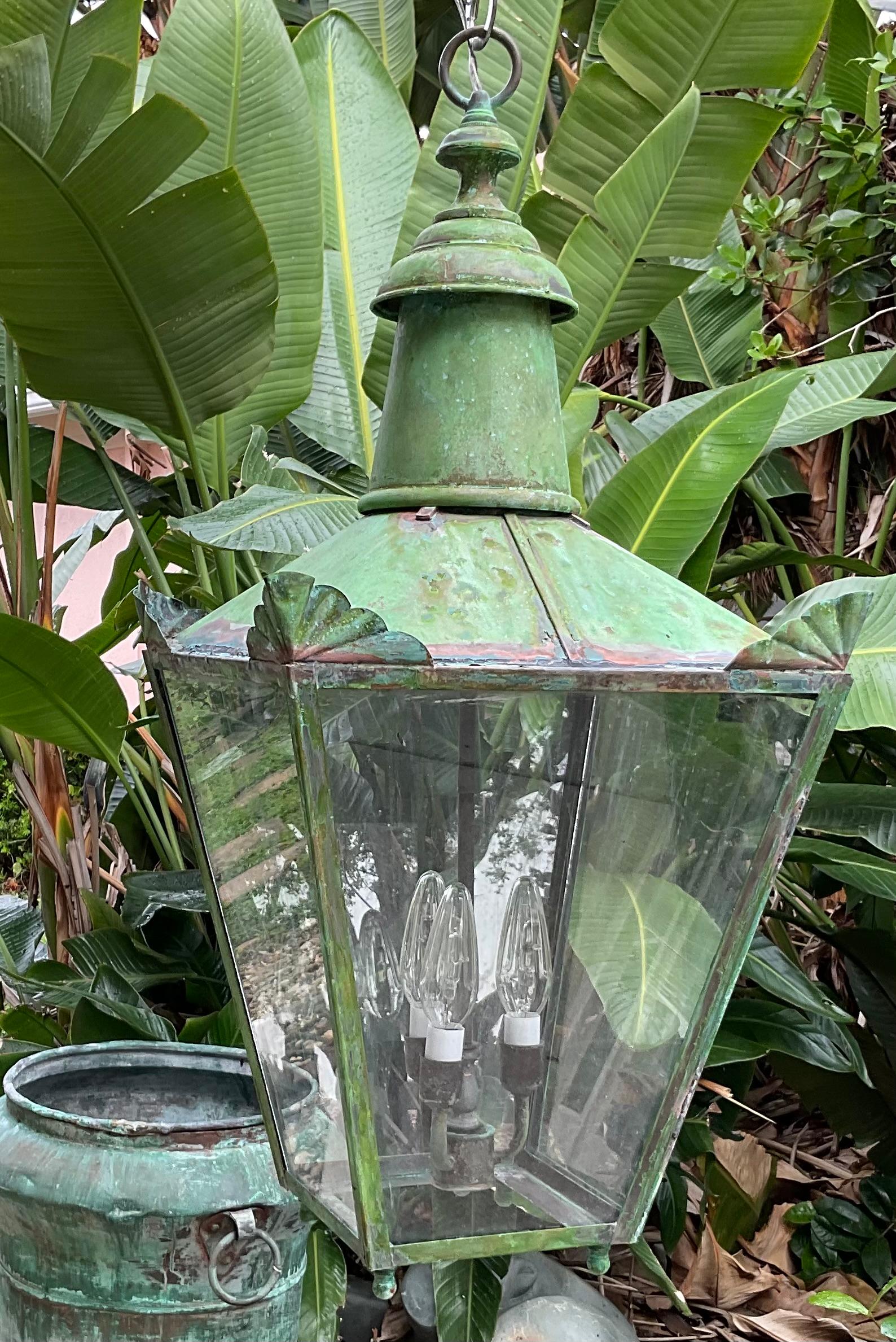 Beautiful vintage lantern made form brass , with three 60/watt lights.
Electrified and ready to use Beautiful oxidization patina.
Will look great indoor or outdoor.
Chain and canopy included.