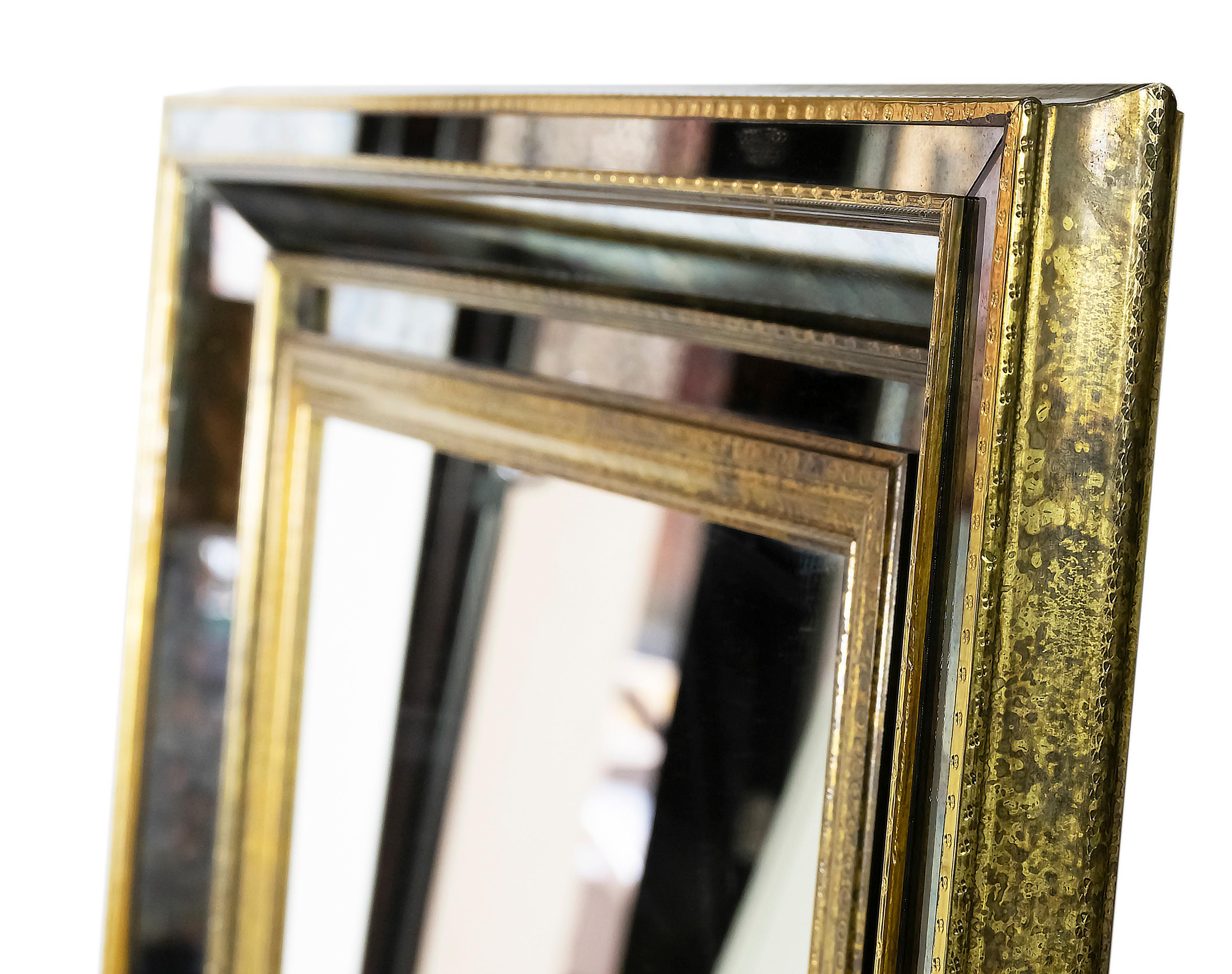 Large vintage French brass on wood wall mirror.
The frame is mounted with aged brass and decorated with aged mirror.
Heavy and solid.




