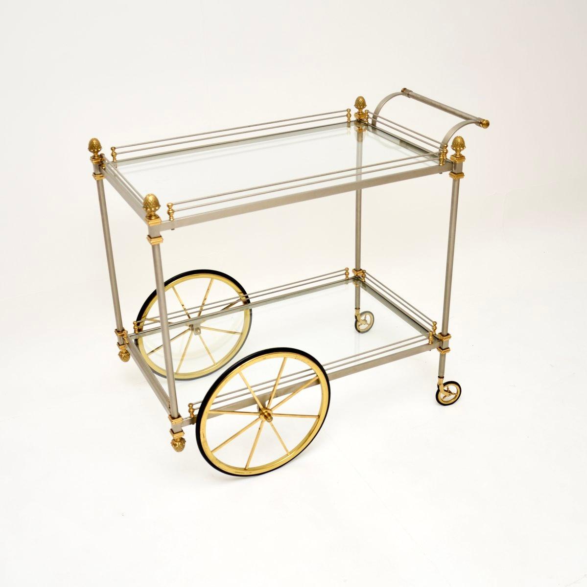 A magnificent and large vintage French drinks trolley in steel and brass, dating from the 1970’s.

This is of exceptional quality, it is extremely finely crafted and is much larger than drinks trolleys usually seen. The brushed steel frame is