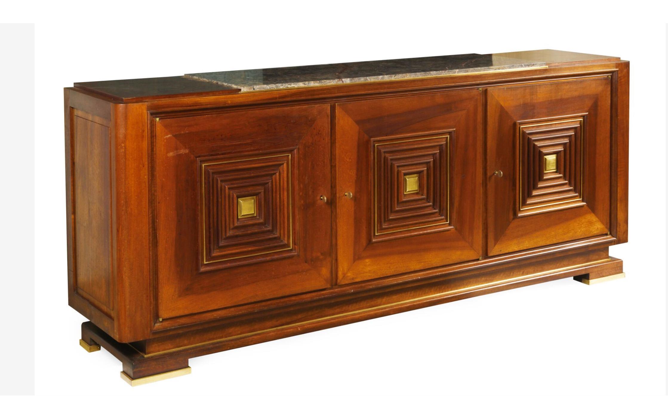 Rectangular vintage mahogany sideboard attributed to the French architect and furniture designer Maxime OLD (1910-1991).
The center of the upper part covered with grey marble, the facade opening with three doors decorated with concentric squares